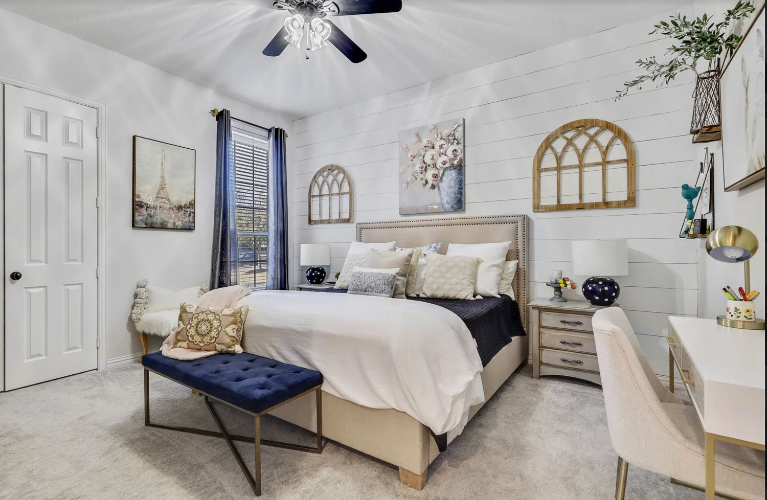 Gray interior paint in a farmhouse style bedroom with custom built in details and warm neutral accents.