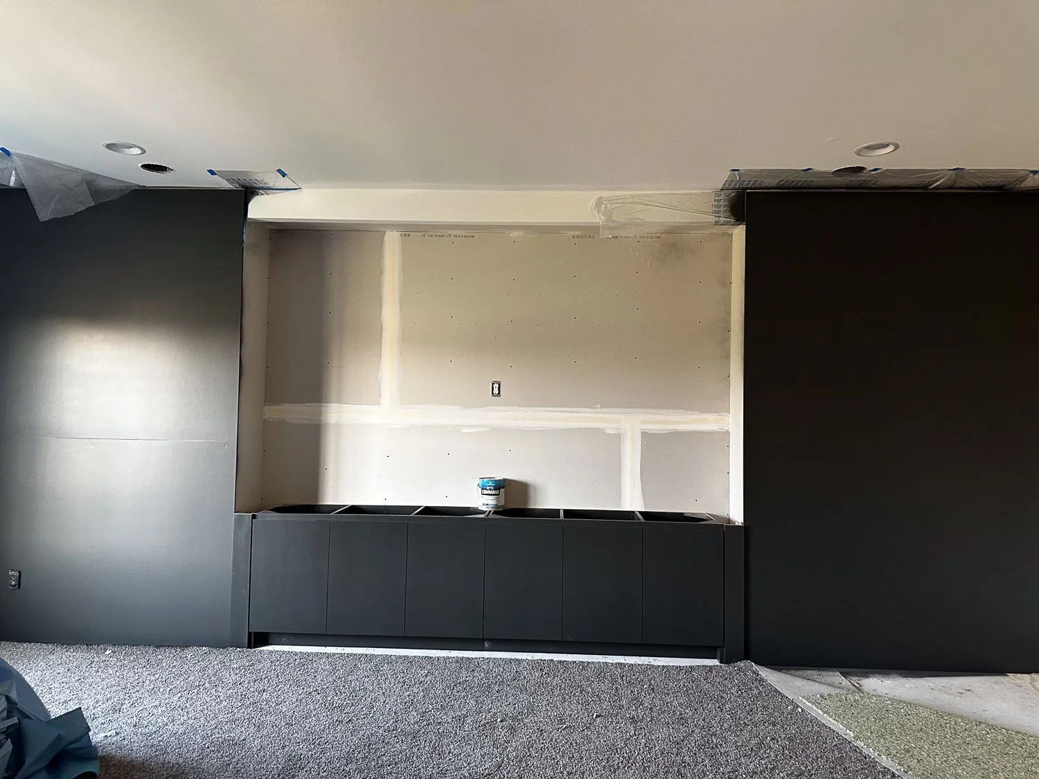 Media Room idea building a new wall with black paint.