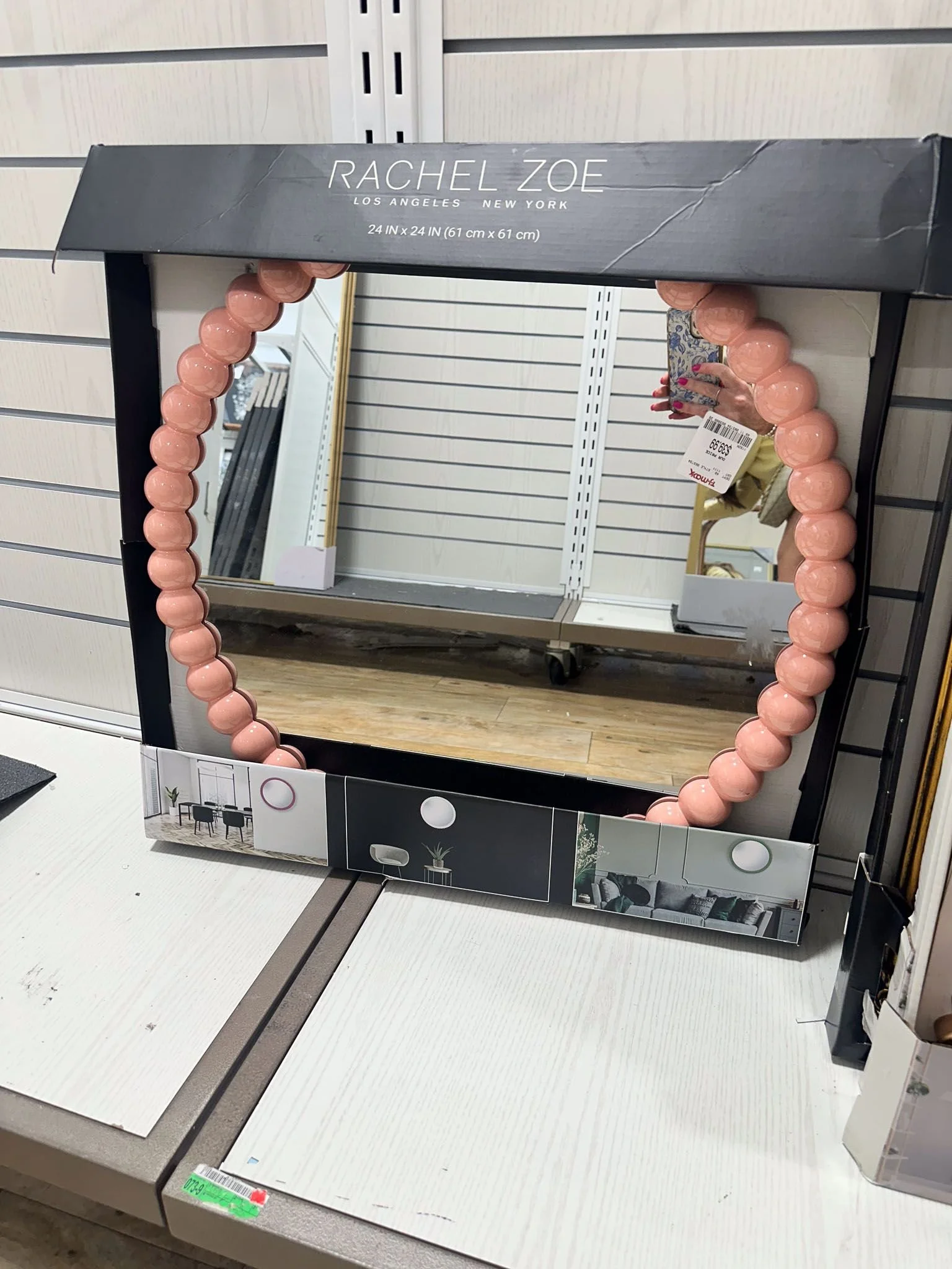 Tabletop mirror being held up as functional college dorm room essentials for dorm room decor.