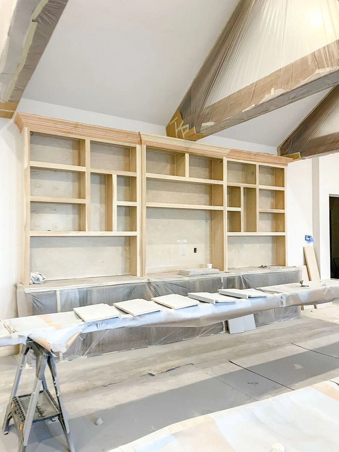 Bright built-in shelving with neutral styling by a Keller interior designer.