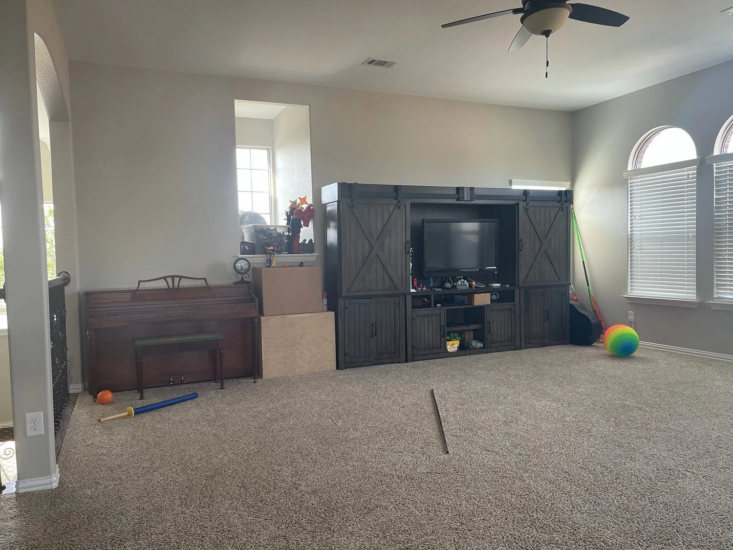 Before photo of a game room makeover project, showing the original room design prior to an interior refresh.