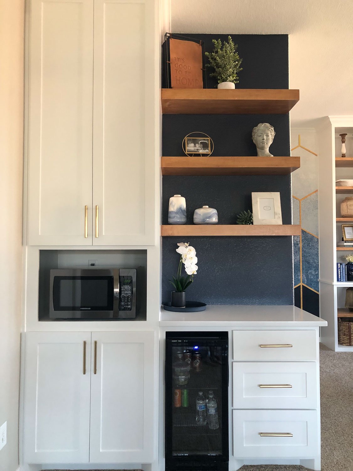Room makeover after photo featuring a bright, refreshed space with modern room design details and updated light fixtures.