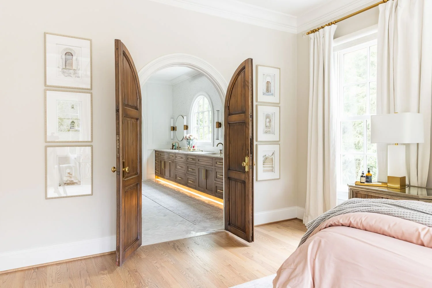 Bedroom in Nashville, TN opening doors to master bathroom.