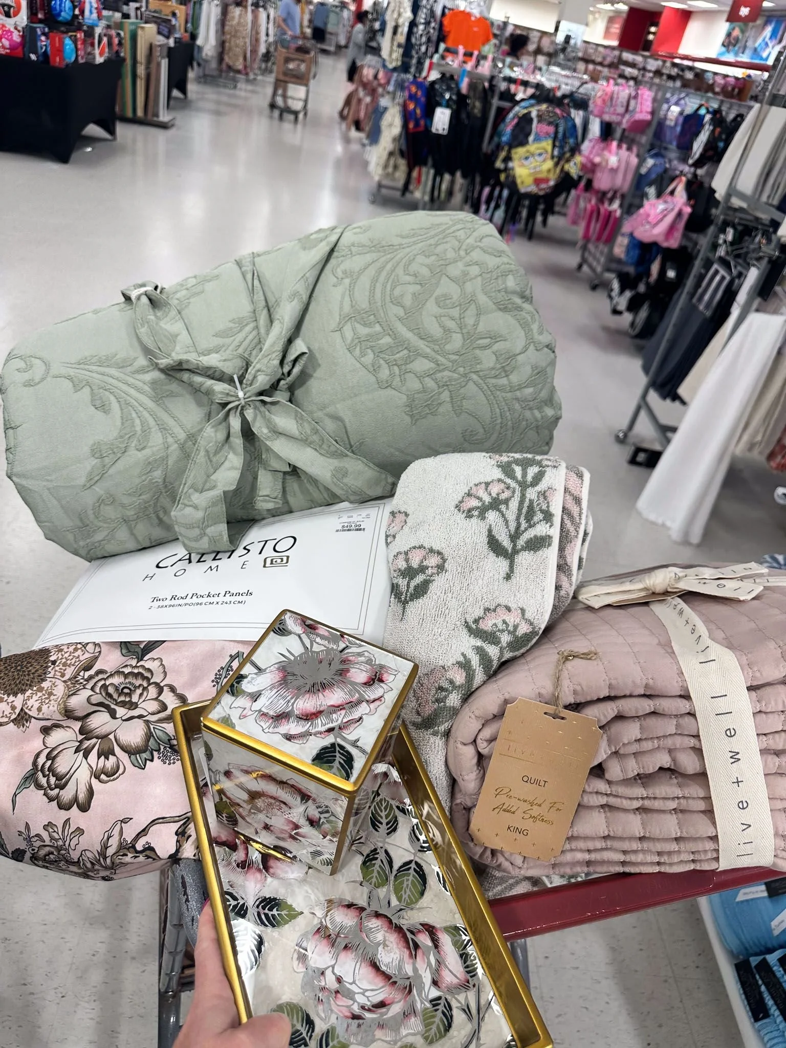 Floral patterned college dorm room bedding and textile essentials displayed for dorm room decorating inspiration.