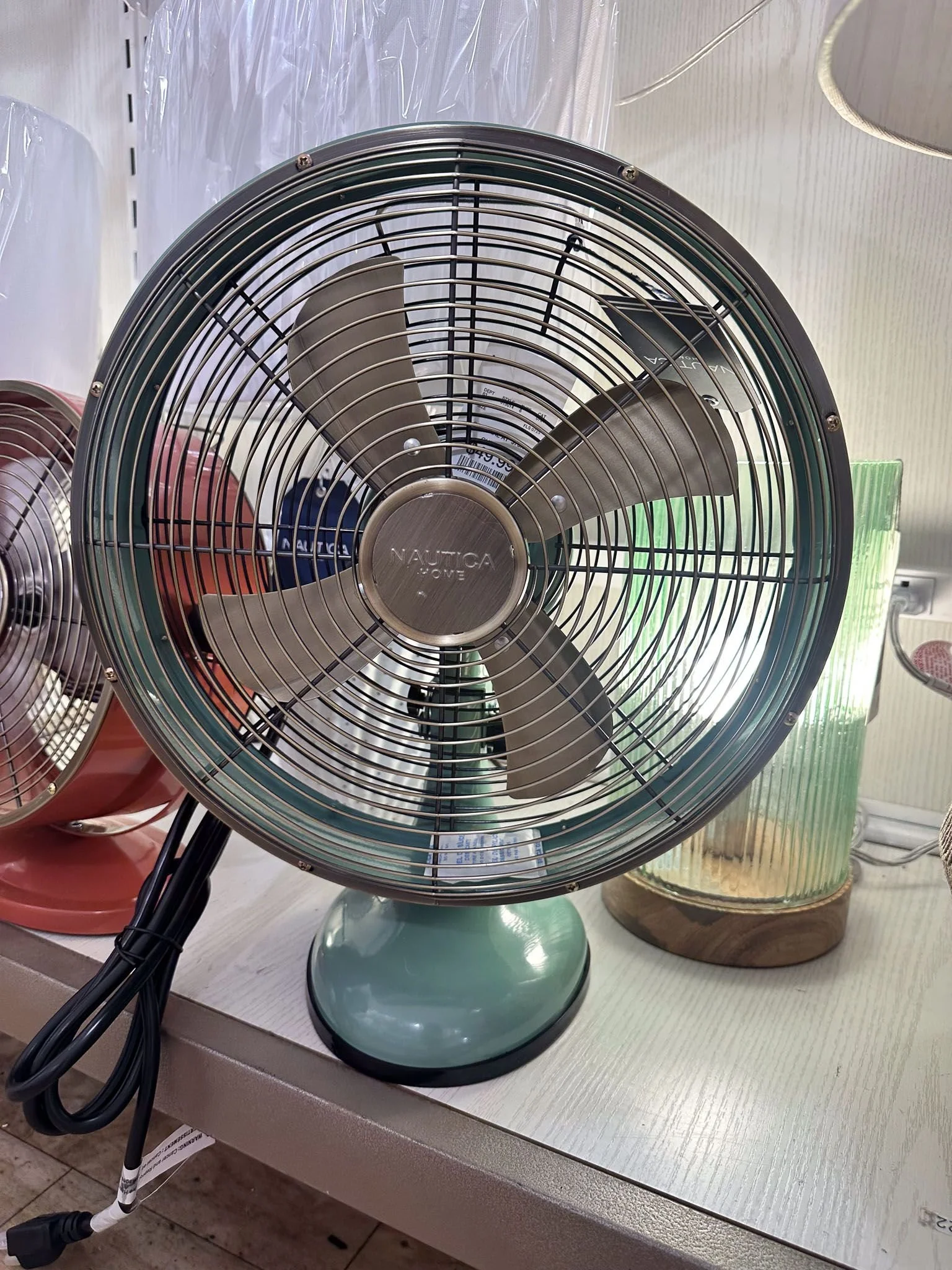 Vintage-style mint green desk fan as functional dorm room decor for college dorm room essentials.