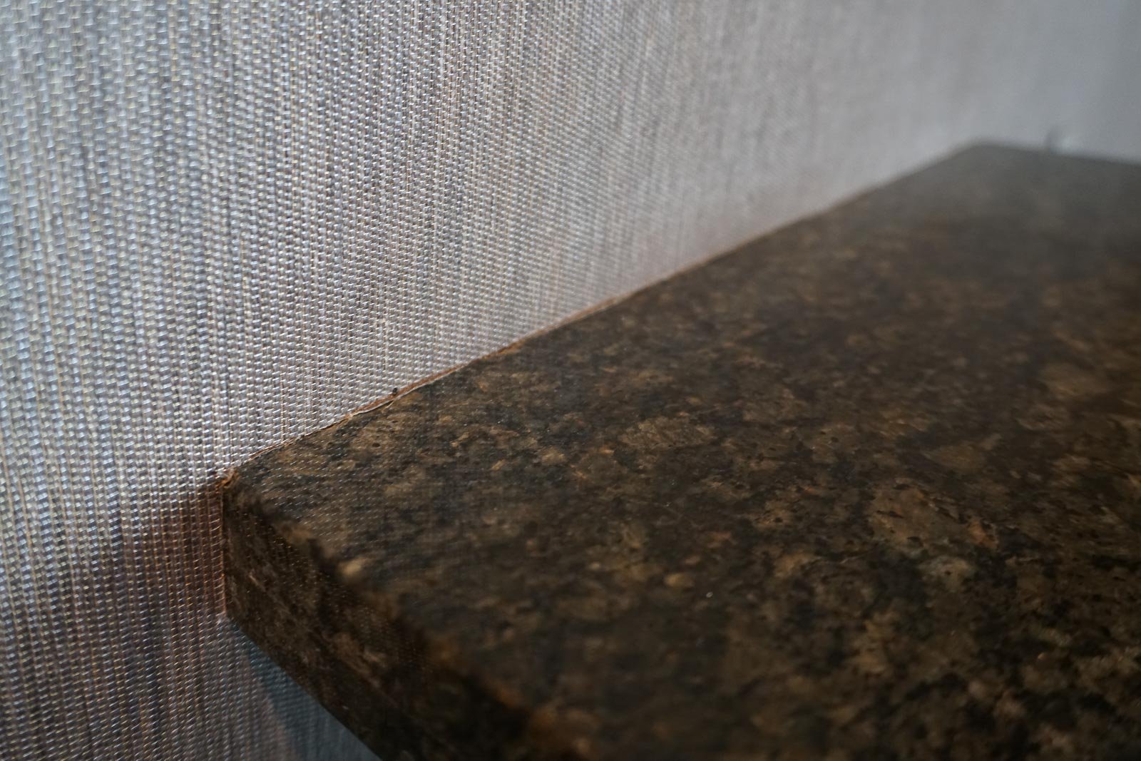 Granite meets fabric wall covering...