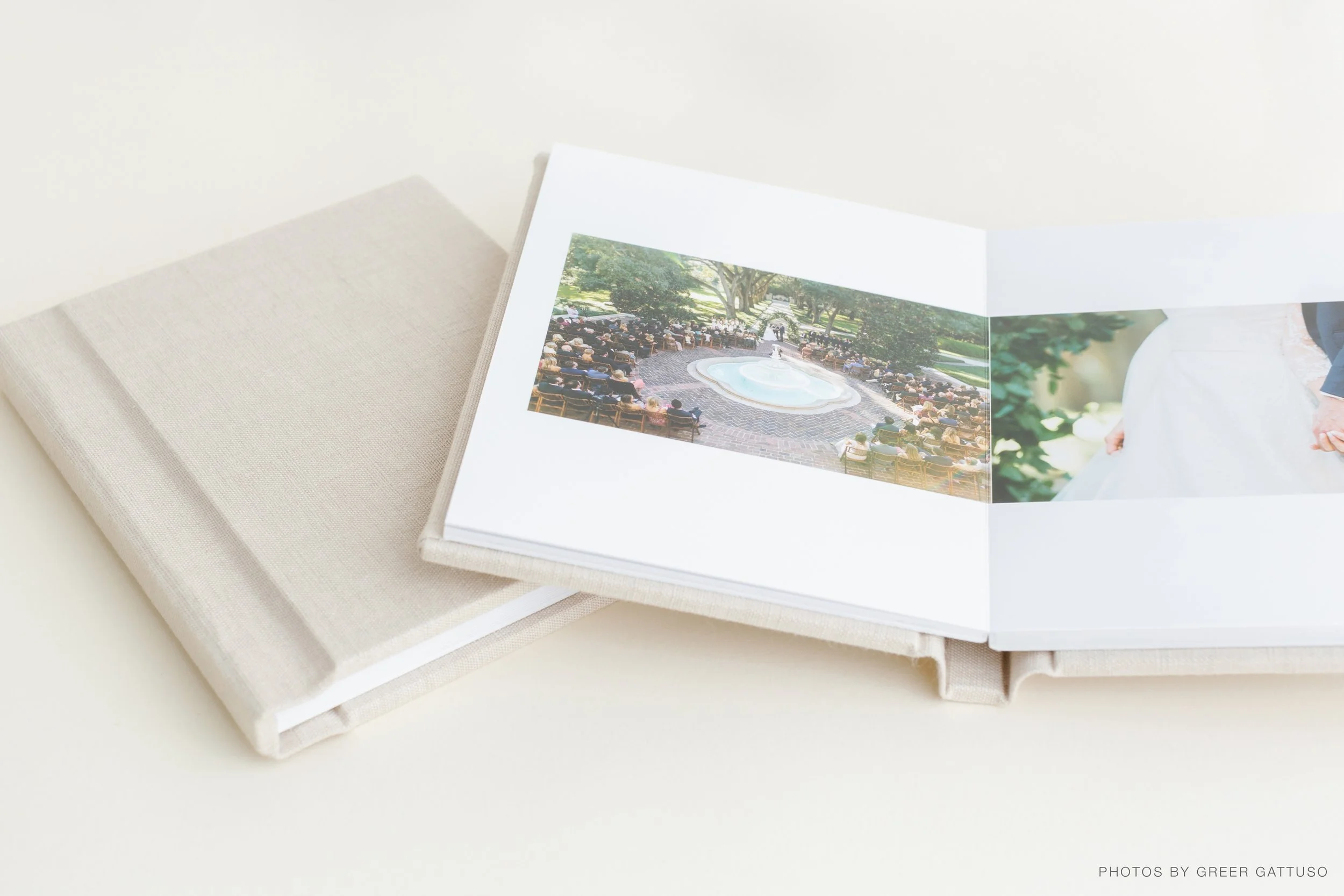 Open photo album displaying images of a park with a fountain and people seated around it, and a close-up of a bride holding hands with a groom.