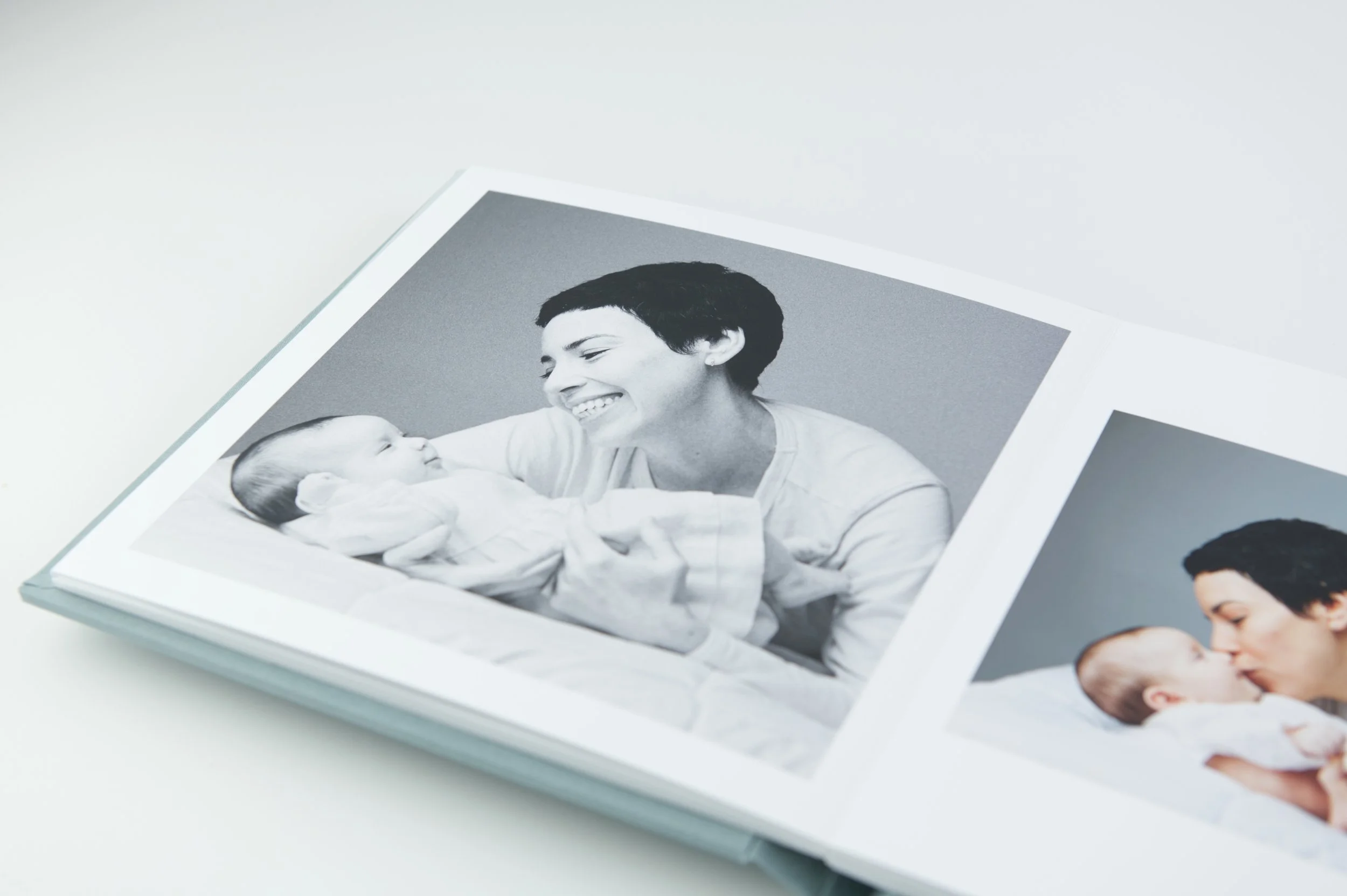 Blue photo album with portrait of mom and baby