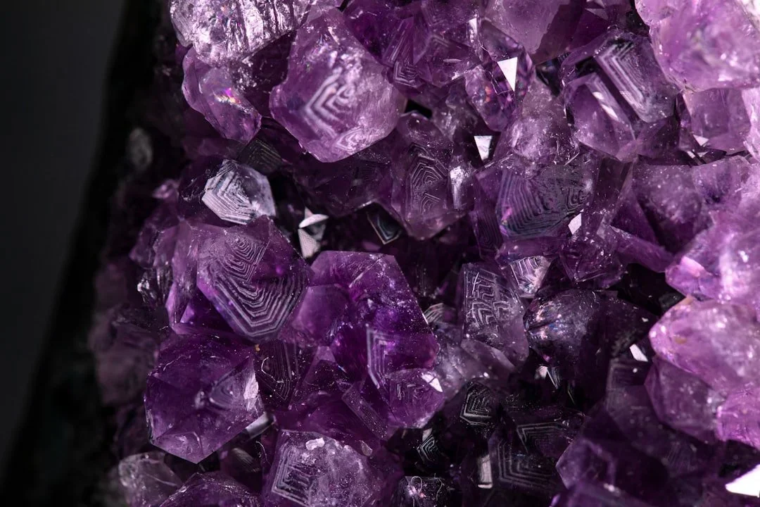 Close-up of purple amethyst crystals with geometric growth patterns
