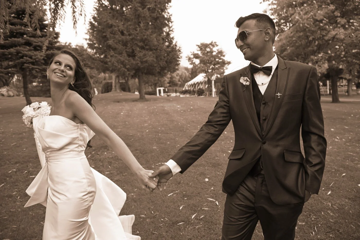A photo of a bride and groom holding hands and looking at each other at Chateau Vaudreuil.