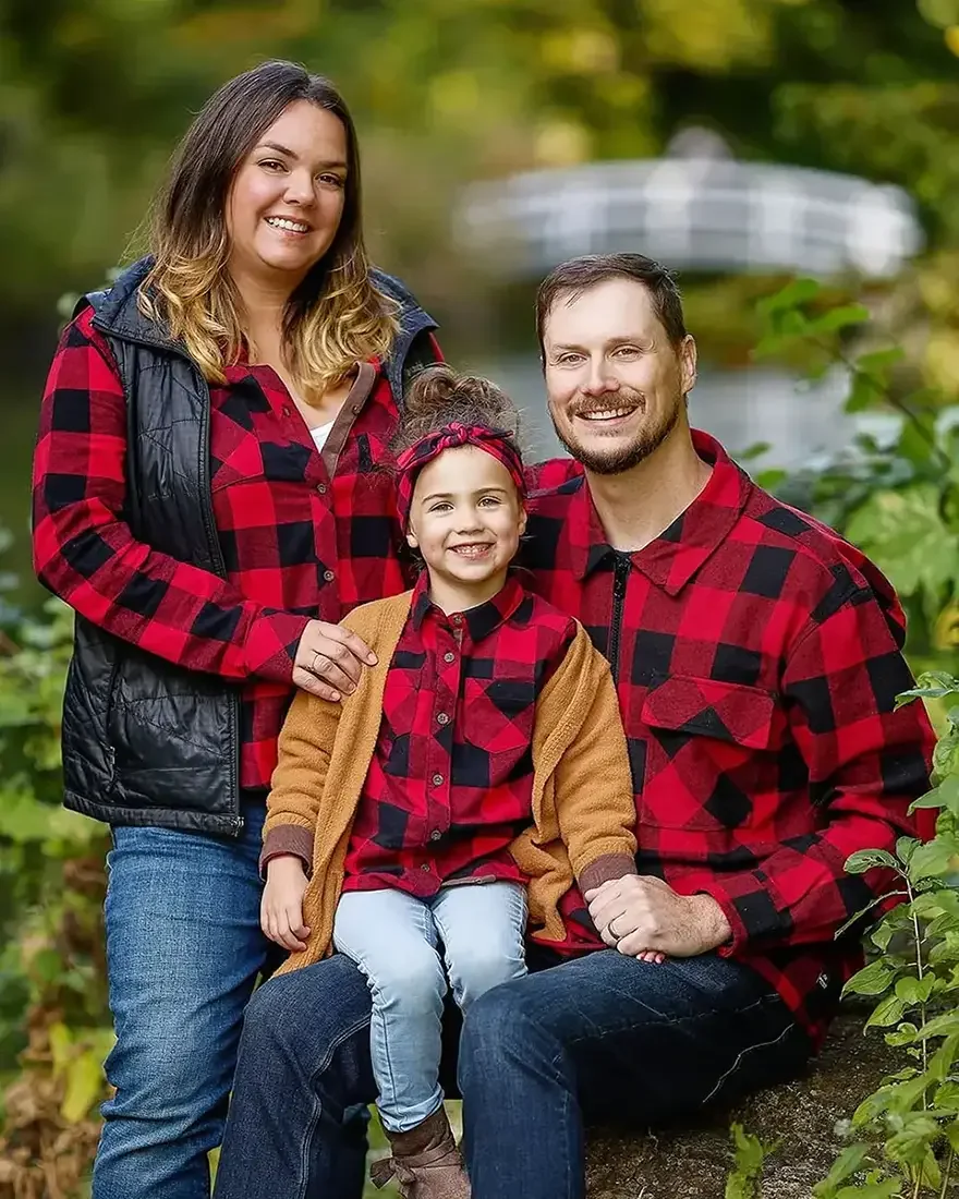 A family portrait of a man, a woman and a girl at Parc Jean-Drapeau in Montreal.
