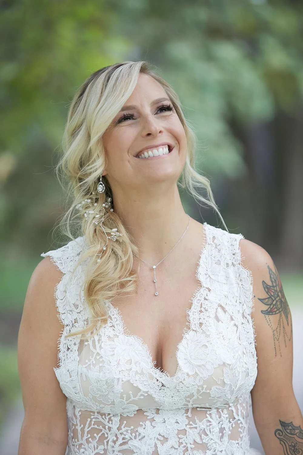 A photo of a bride looking off in the distance and smiling.