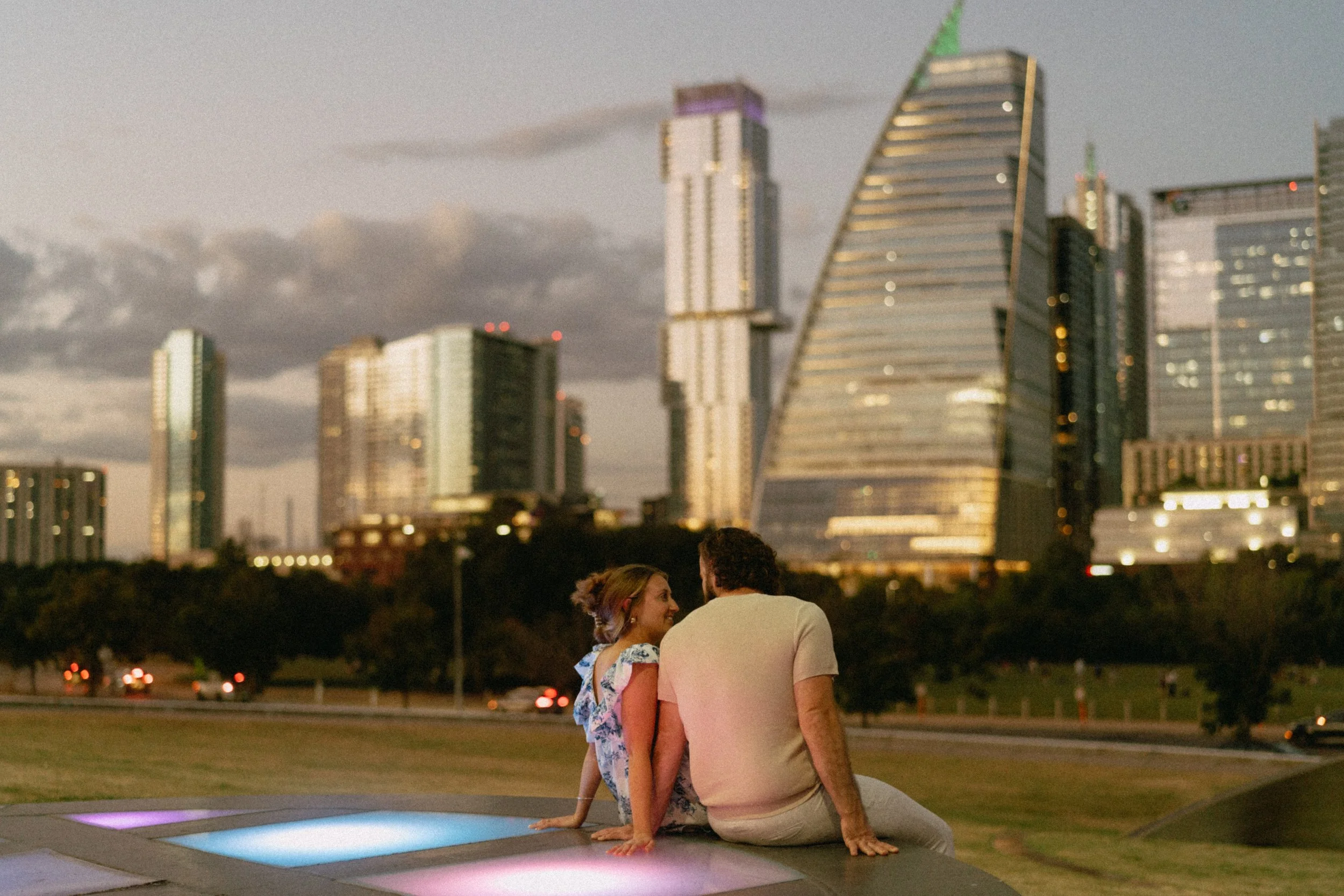 Bride-to-be surprised during proposal at Auditorium Shores with Austin skyline