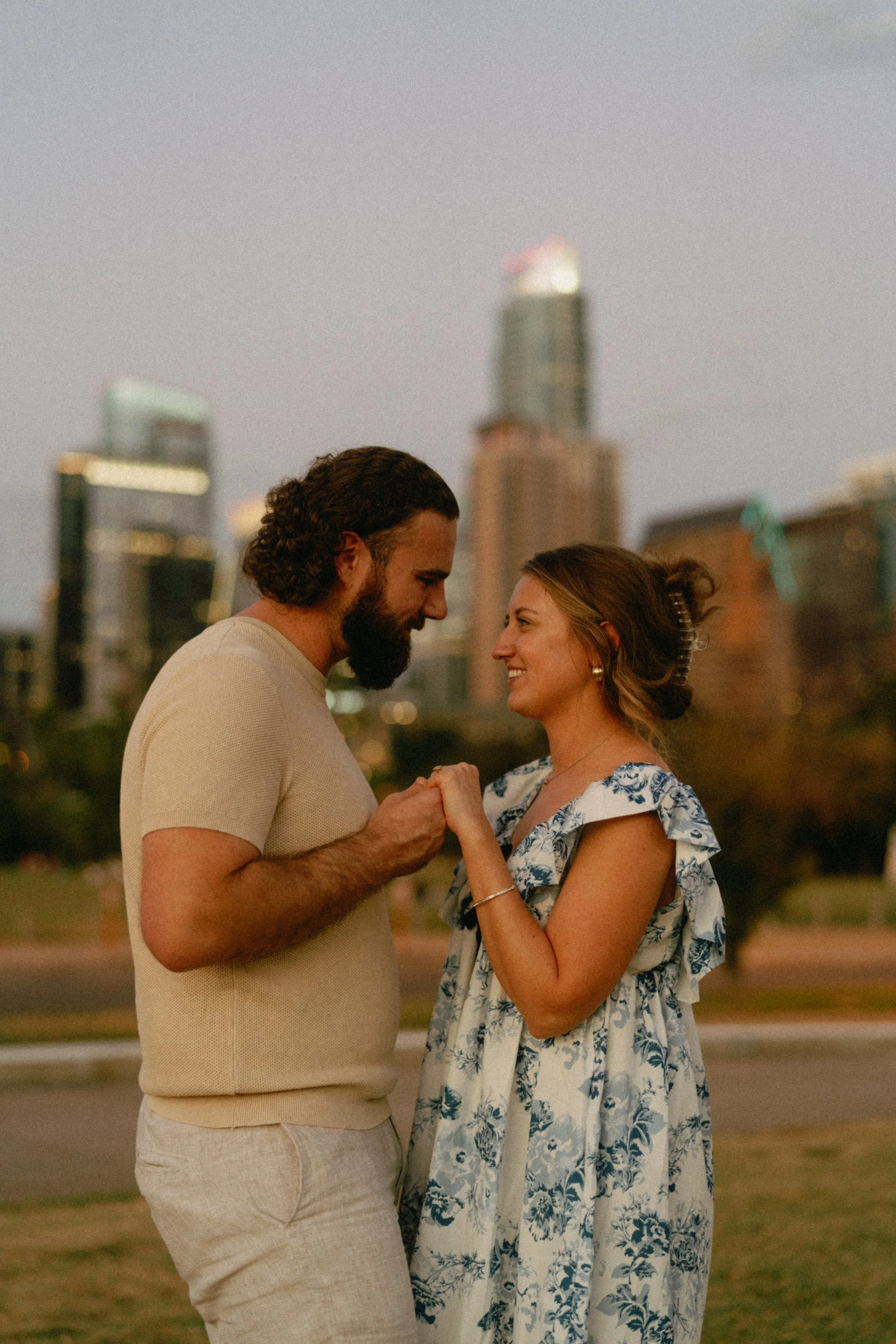 Bride-to-be surprised during proposal at Auditorium Shores with Austin skyline