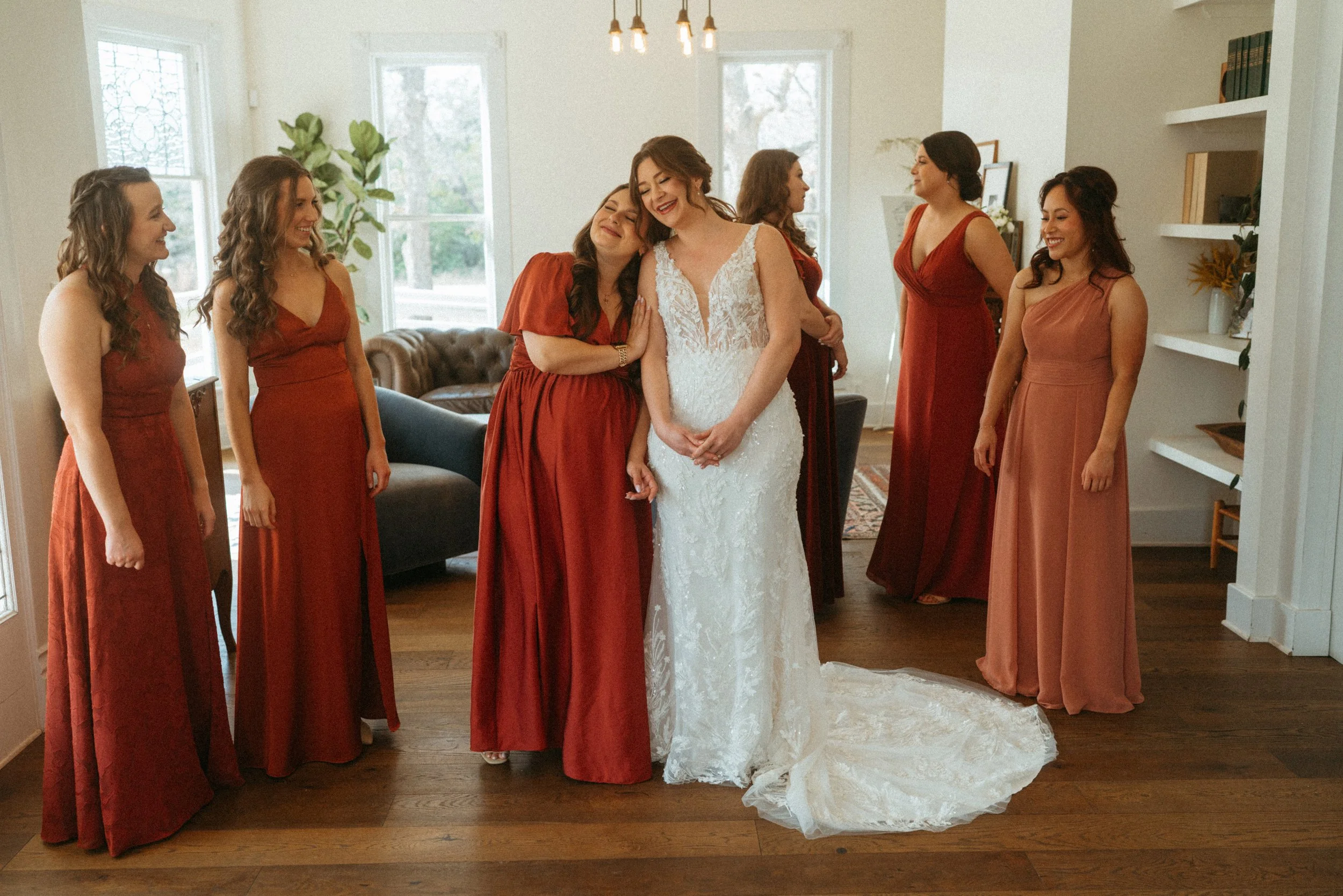 documentary style wedding photography candid of the first look between the bride and her bridesmaids at The Grand Lady in manor tx just outside of austin