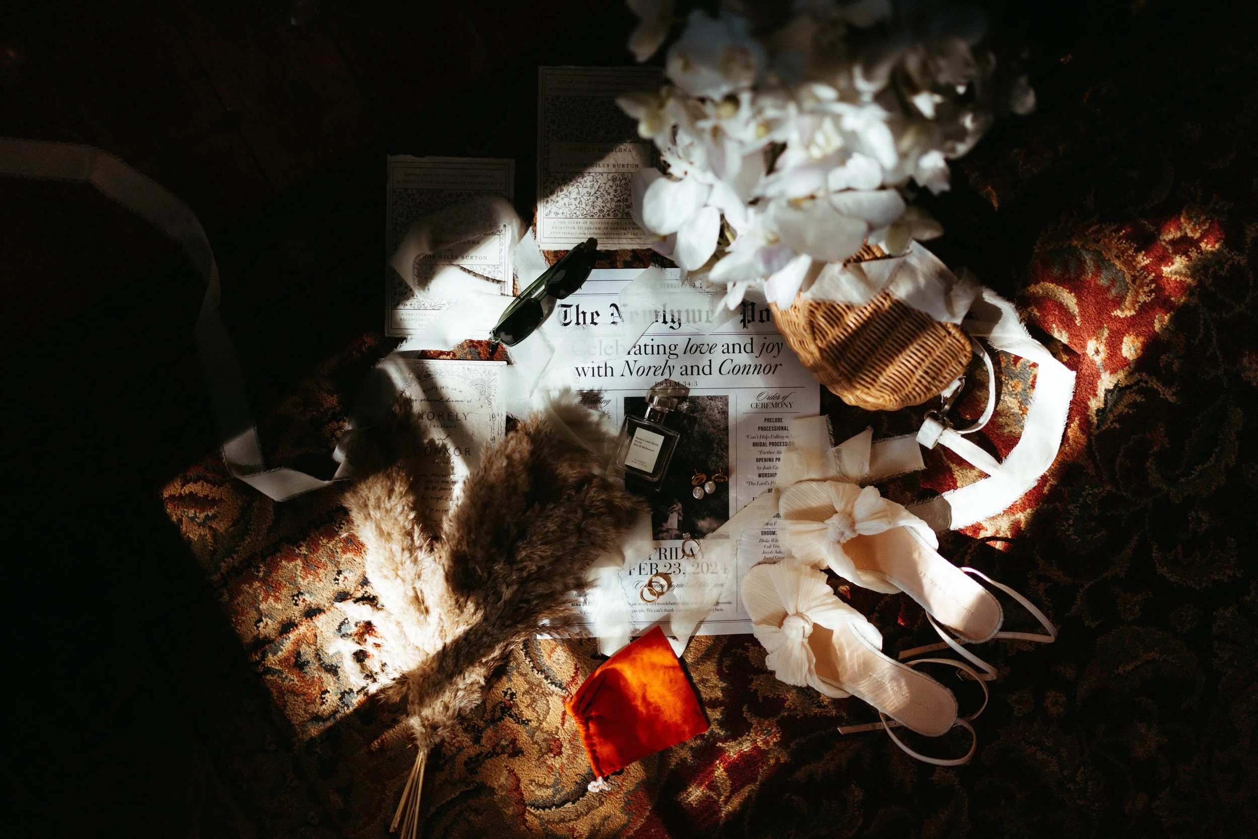 Flat lay of wedding invitations and rings | documentary Austin wedding photographer.