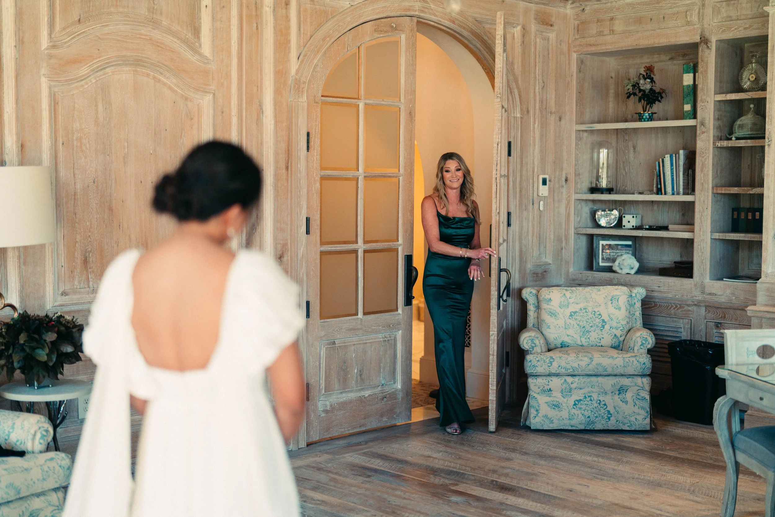 Bride sharing first look with bridesmaids in classic bridesmaids dresses at Houston Oaks Country Club and Retreat