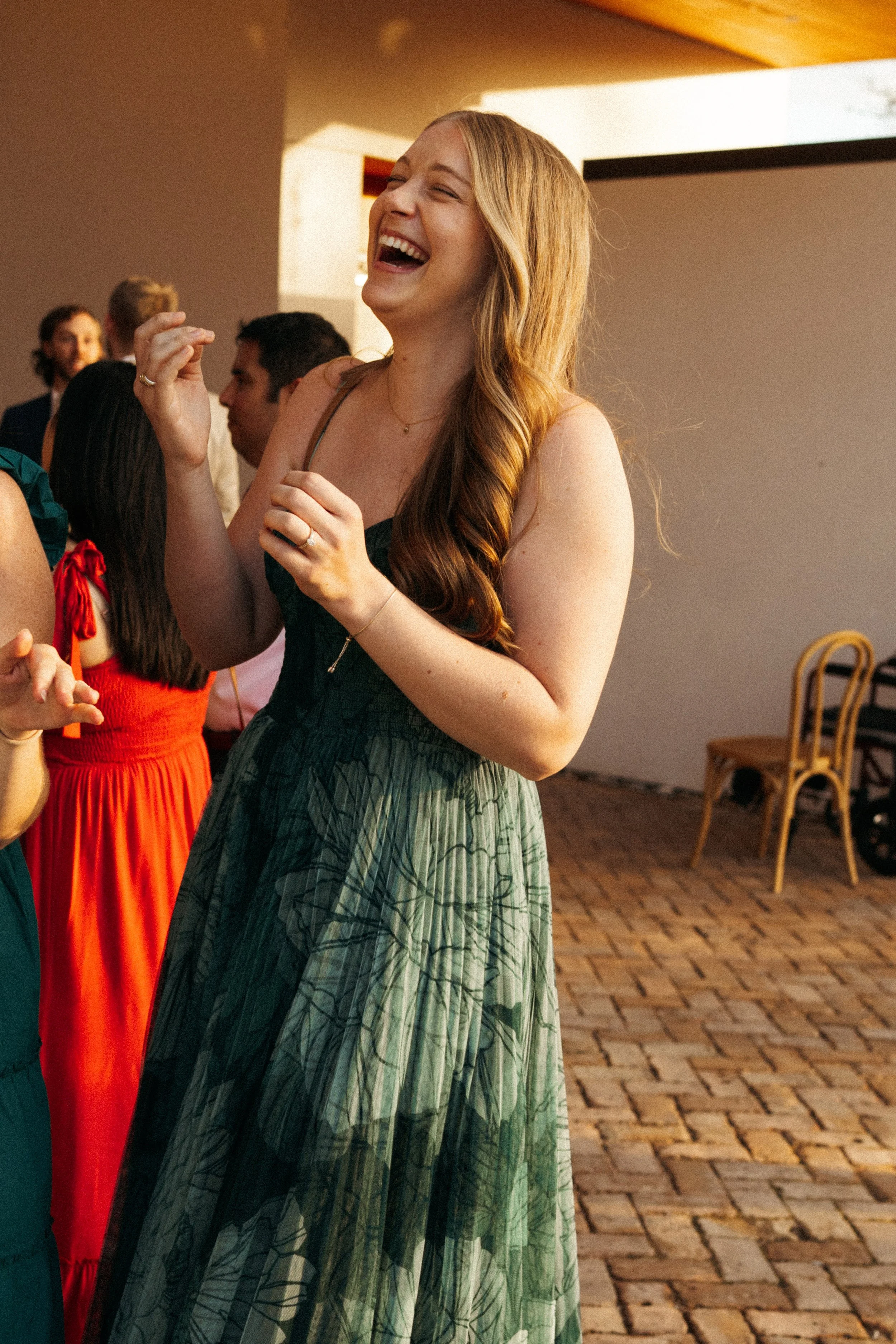Guests laughing during cocktail hour at The Grand Lady wedding
