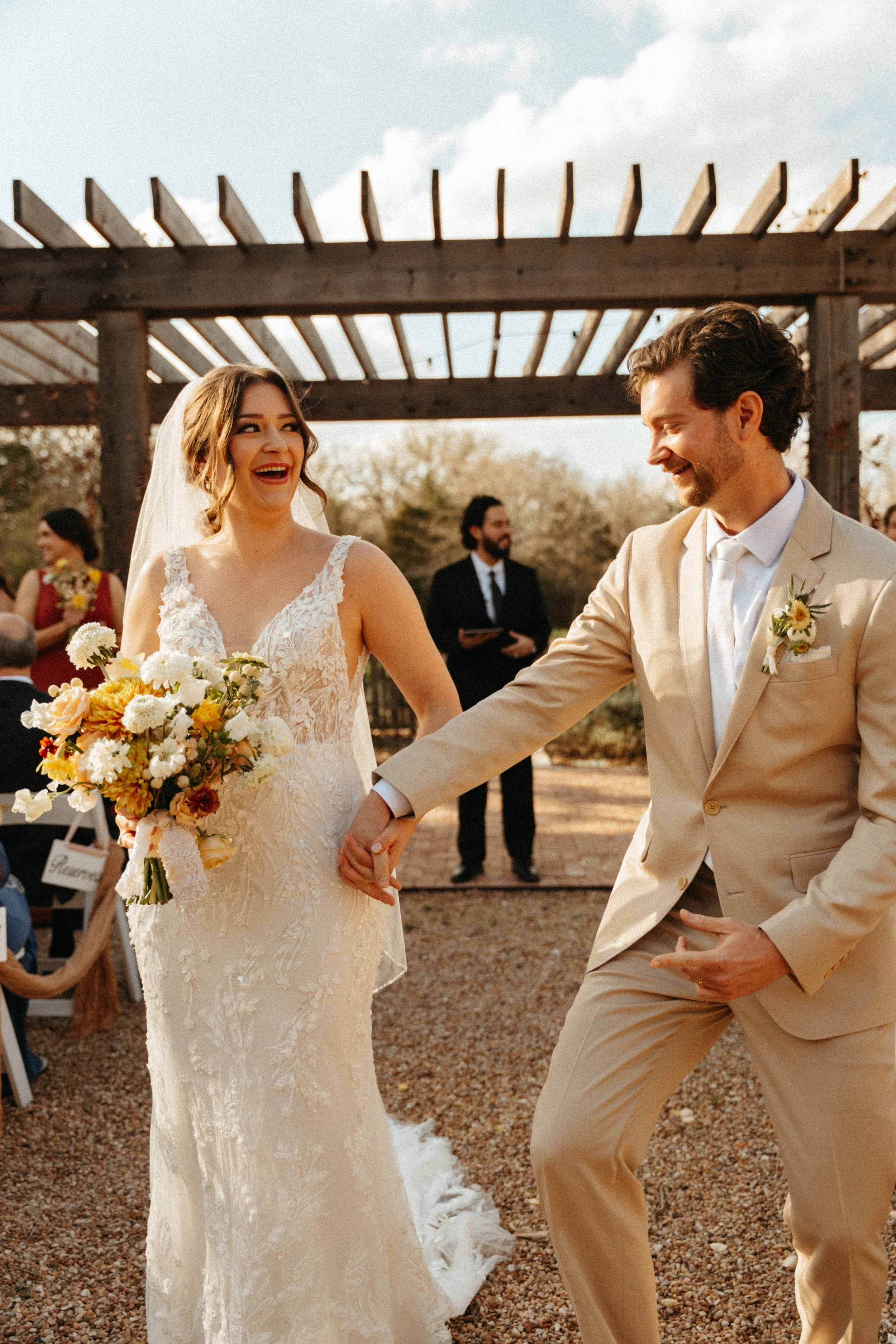 Bride and groom recess out of their flower garden wedding ceremony at The Grand Lady