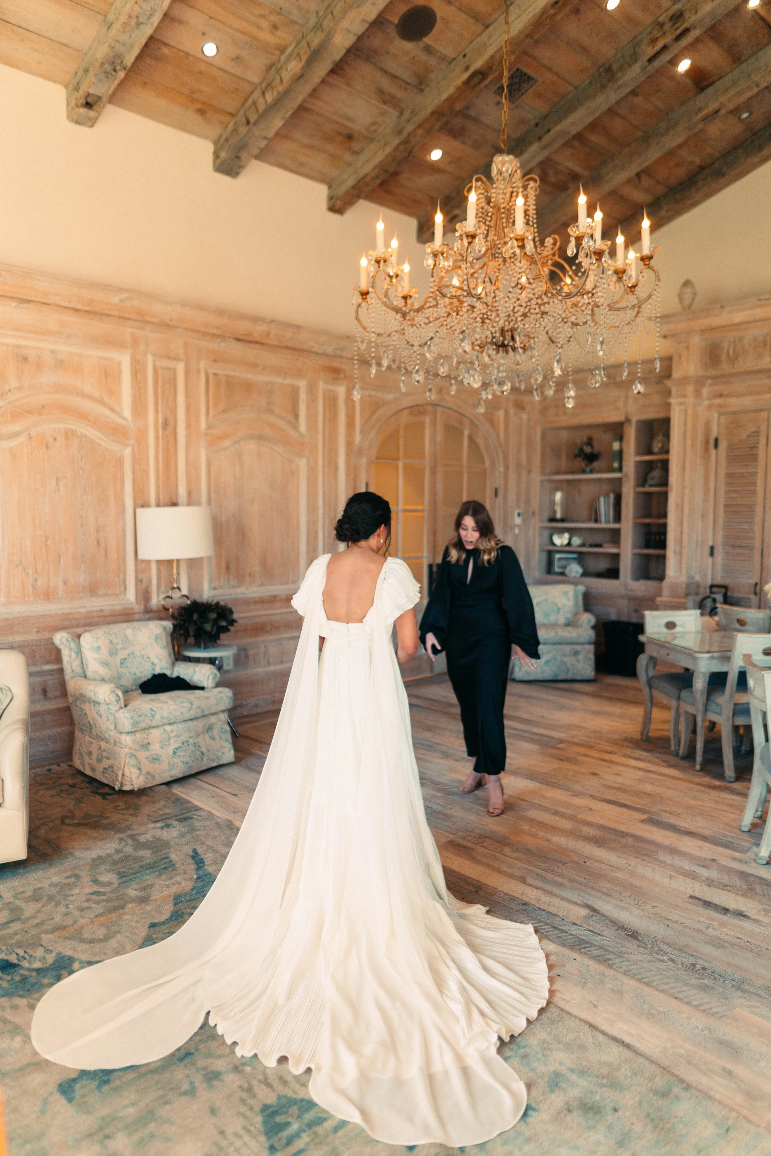 Bride sharing an emotional first look with her bridesmaids at Houston Oaks | documentary Austin travel wedding photographer.