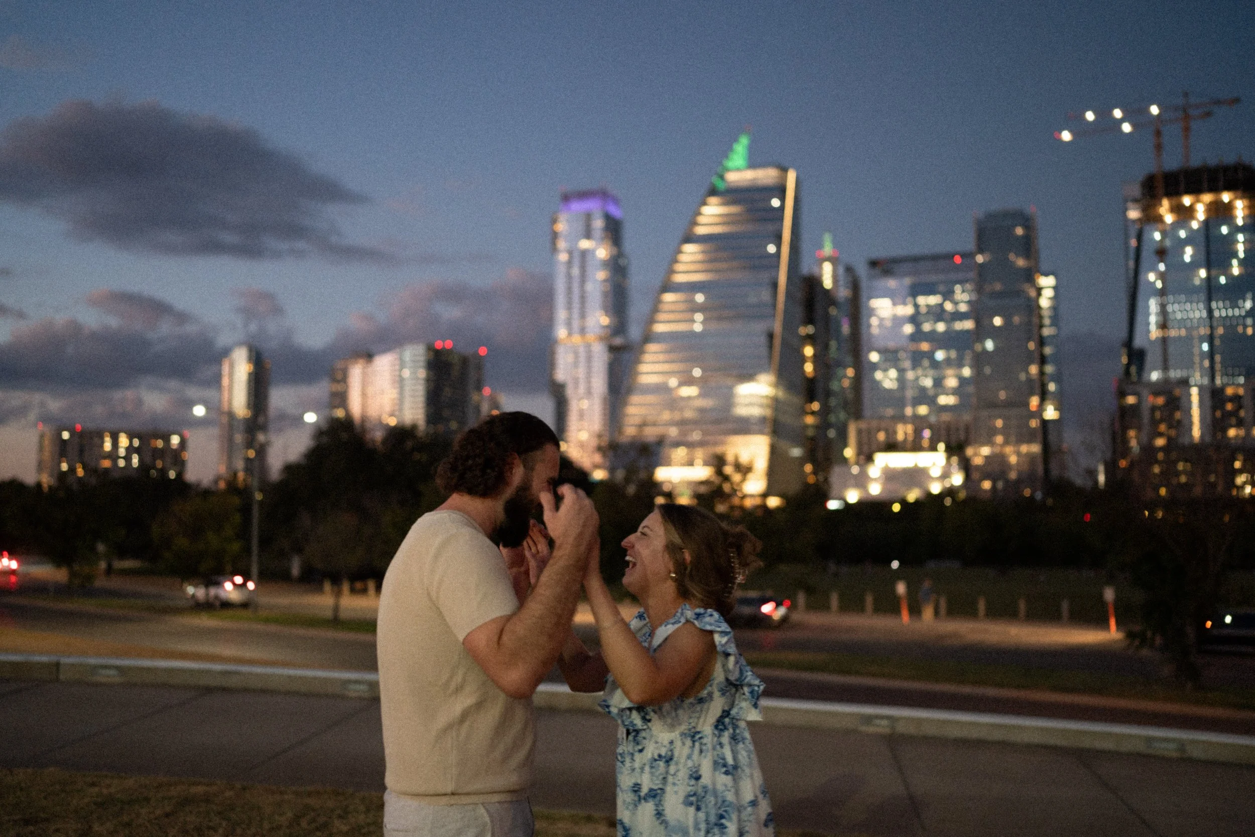 Bride-to-be surprised during proposal at Auditorium Shores with Austin skyline