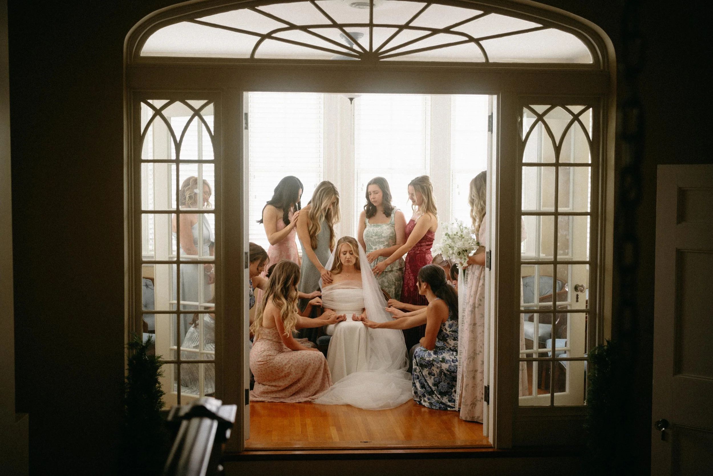 emotional pre-ceremony prayer with bride and bridesmaids