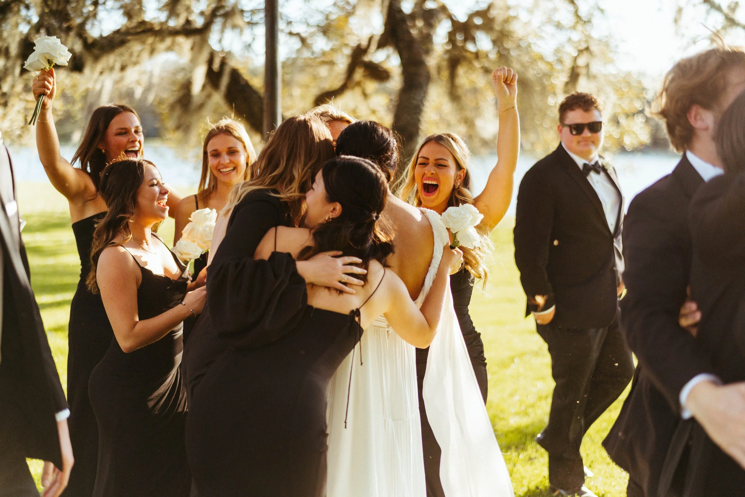 Wedding party laughing together during Houston Oaks wedding portraits | Austin travel wedding photographer.