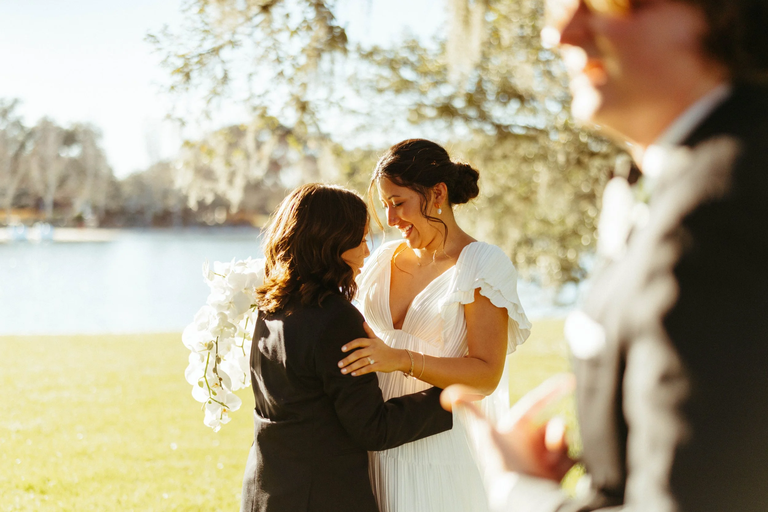 Bride holding white orchid bouquet during portraits | Austin wedding photographer.