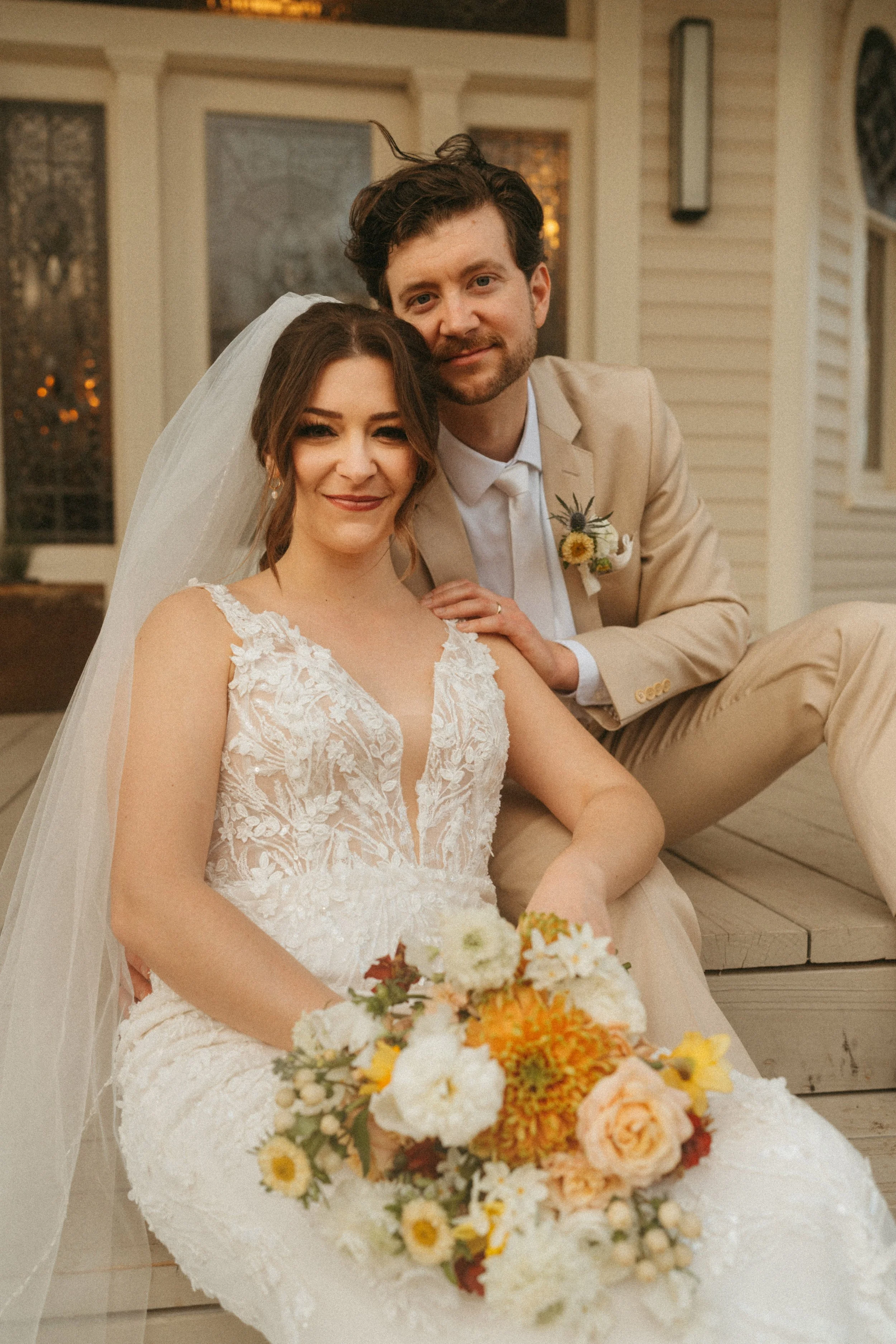 Bride and groom candid in front of The Grand Lady historic mansion