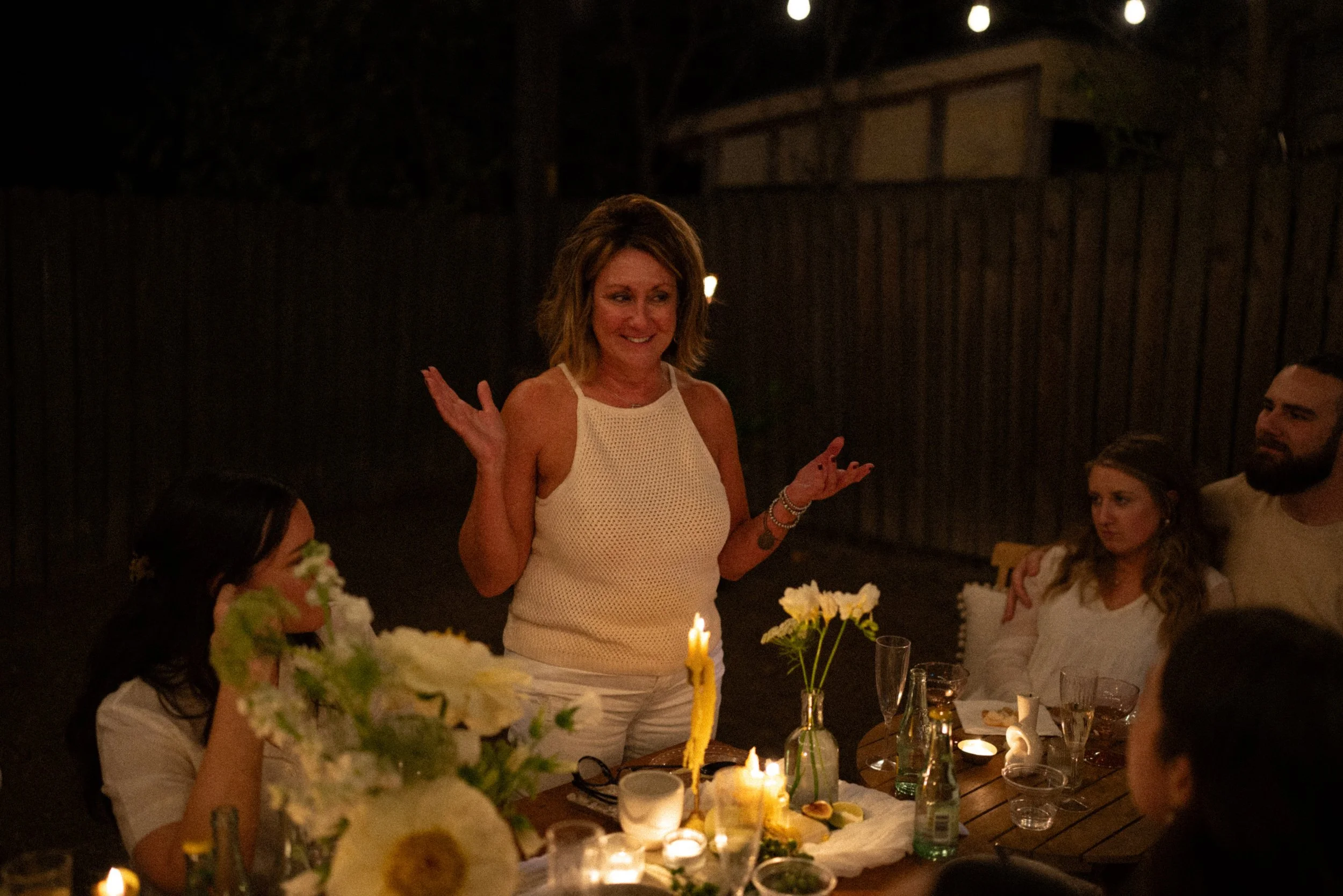 Austin wedding photographer capturing heartfelt speeches at engagement party