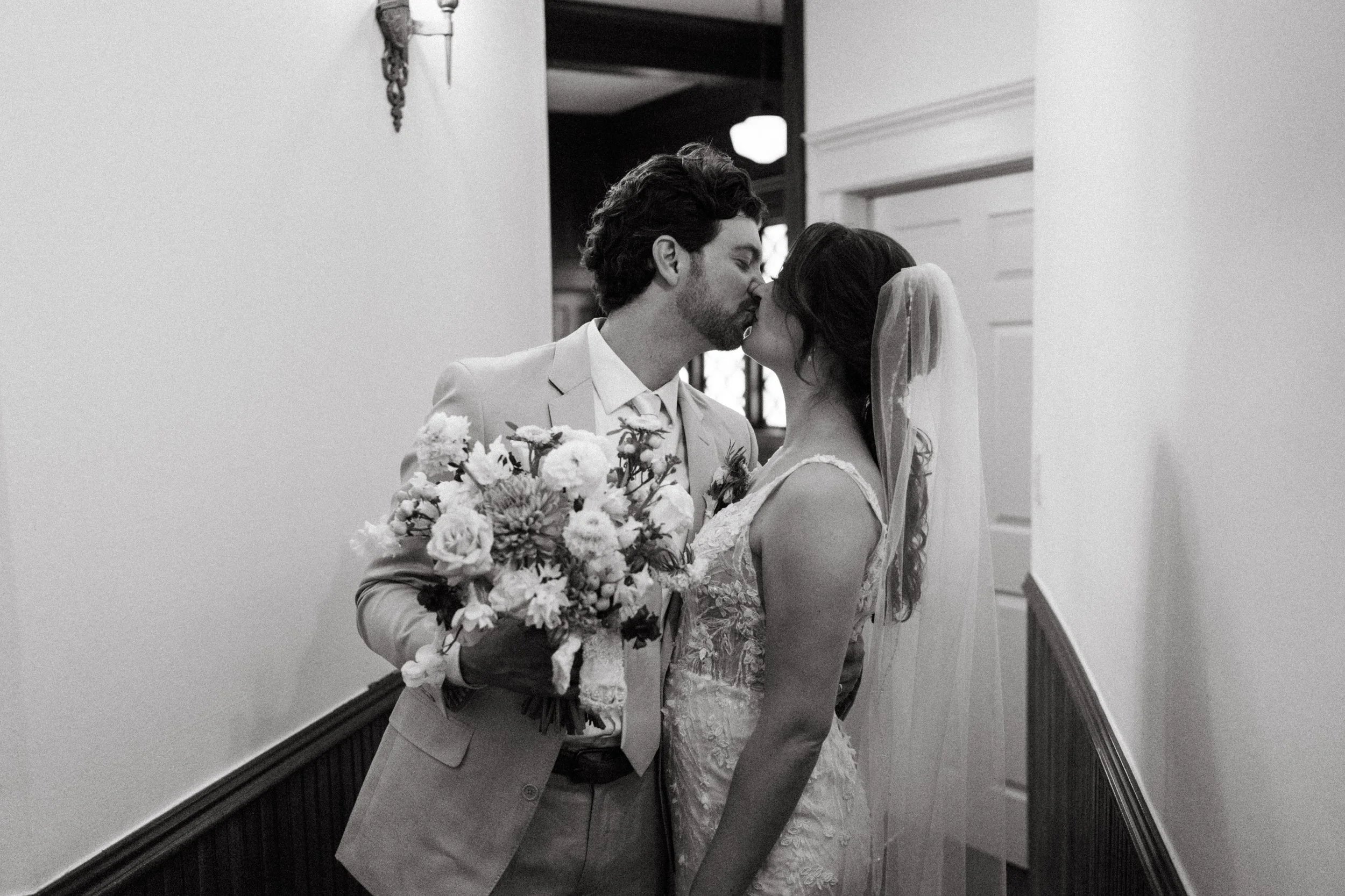 Joyful couple portrait in The Grand Lady mansion kitchen