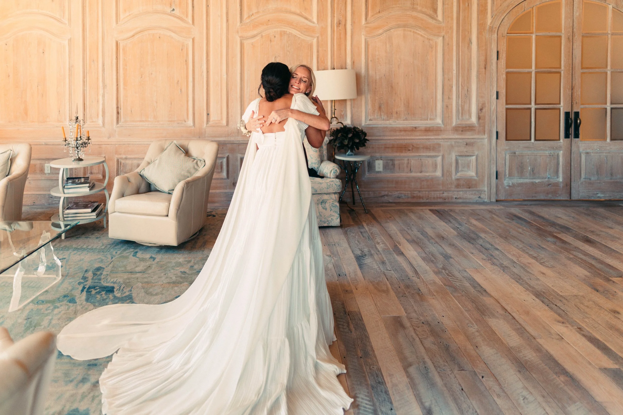 Bride sharing an emotional first look with her bridesmaids at Houston Oaks | documentary Austin travel wedding photographer.