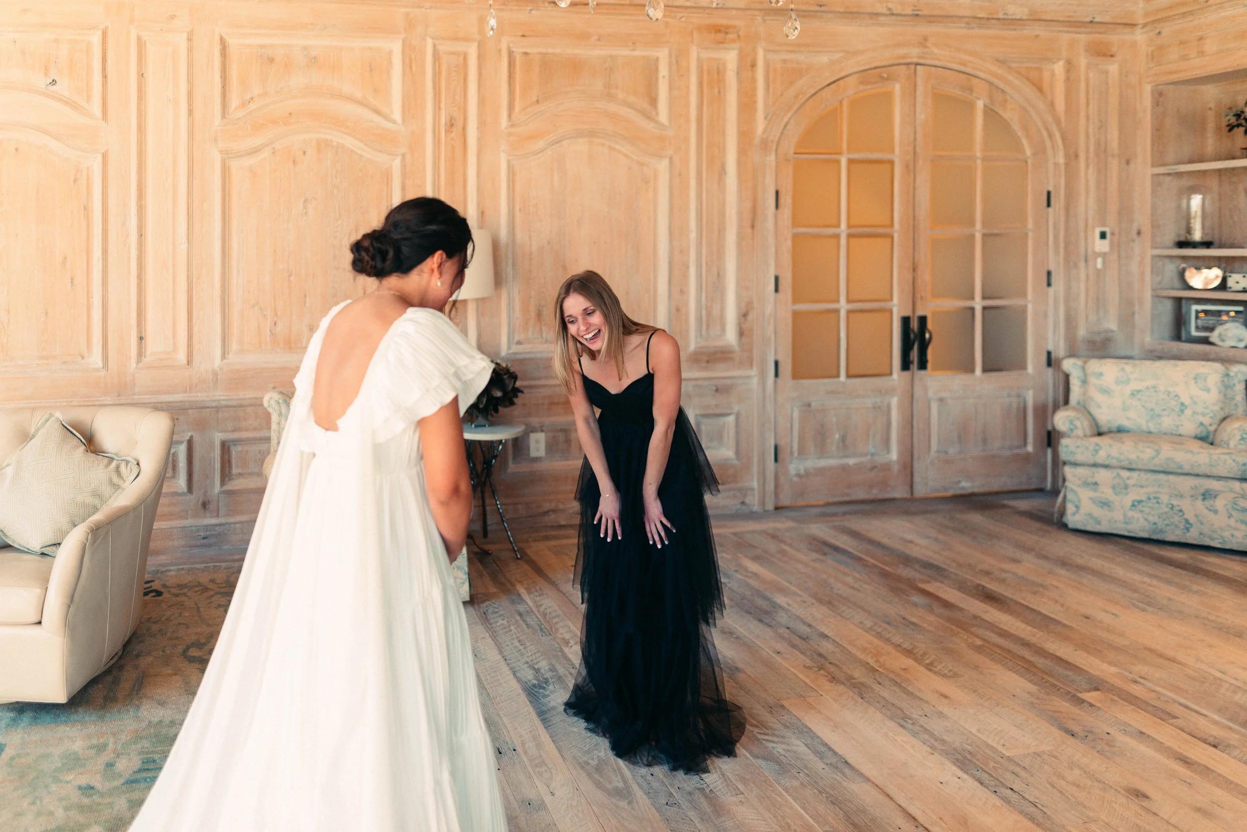 Bride sharing an emotional first look with her bridesmaids at Houston Oaks | documentary Austin travel wedding photographer.