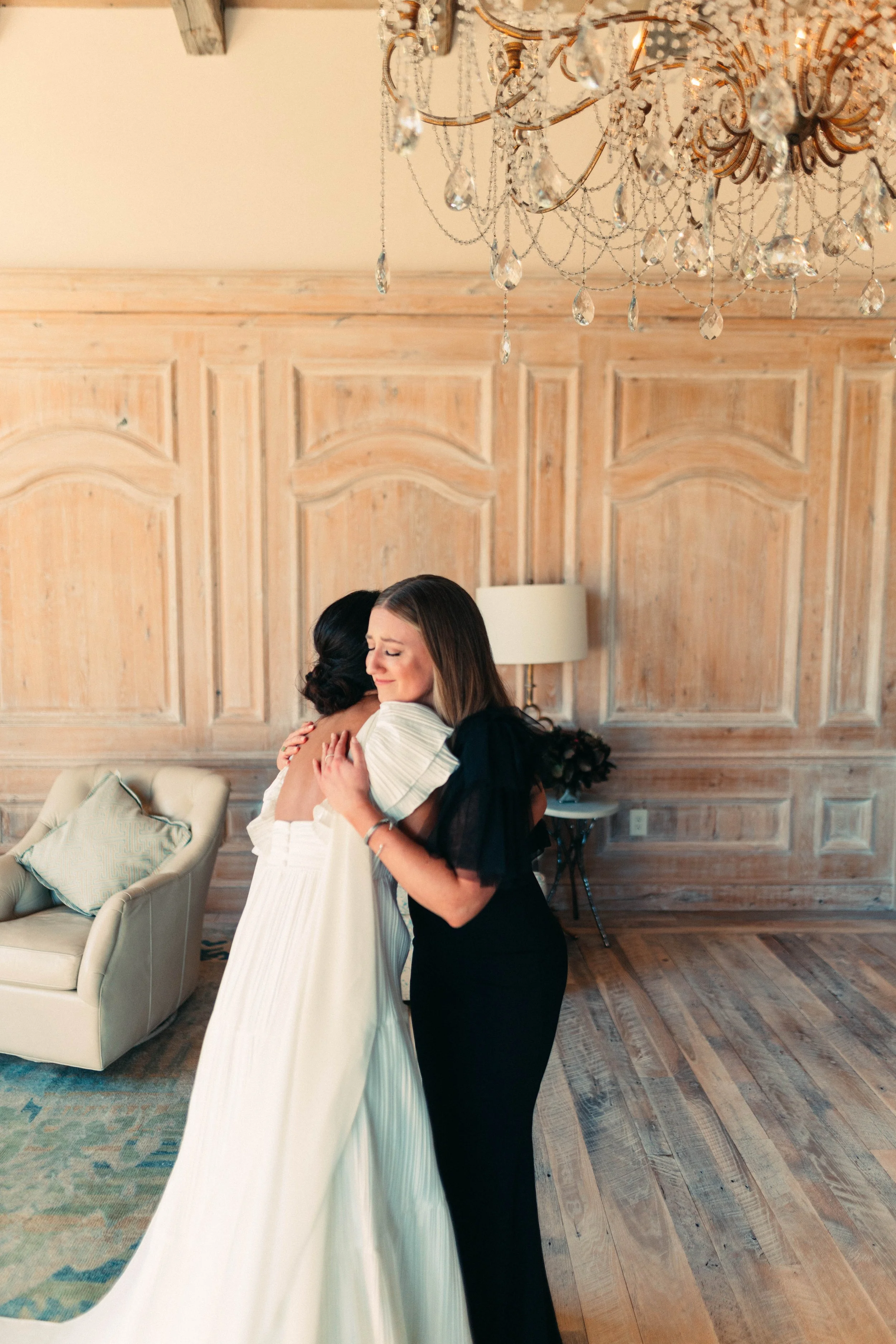 Bride sharing an emotional first look with her bridesmaids at Houston Oaks | documentary Austin travel wedding photographer.