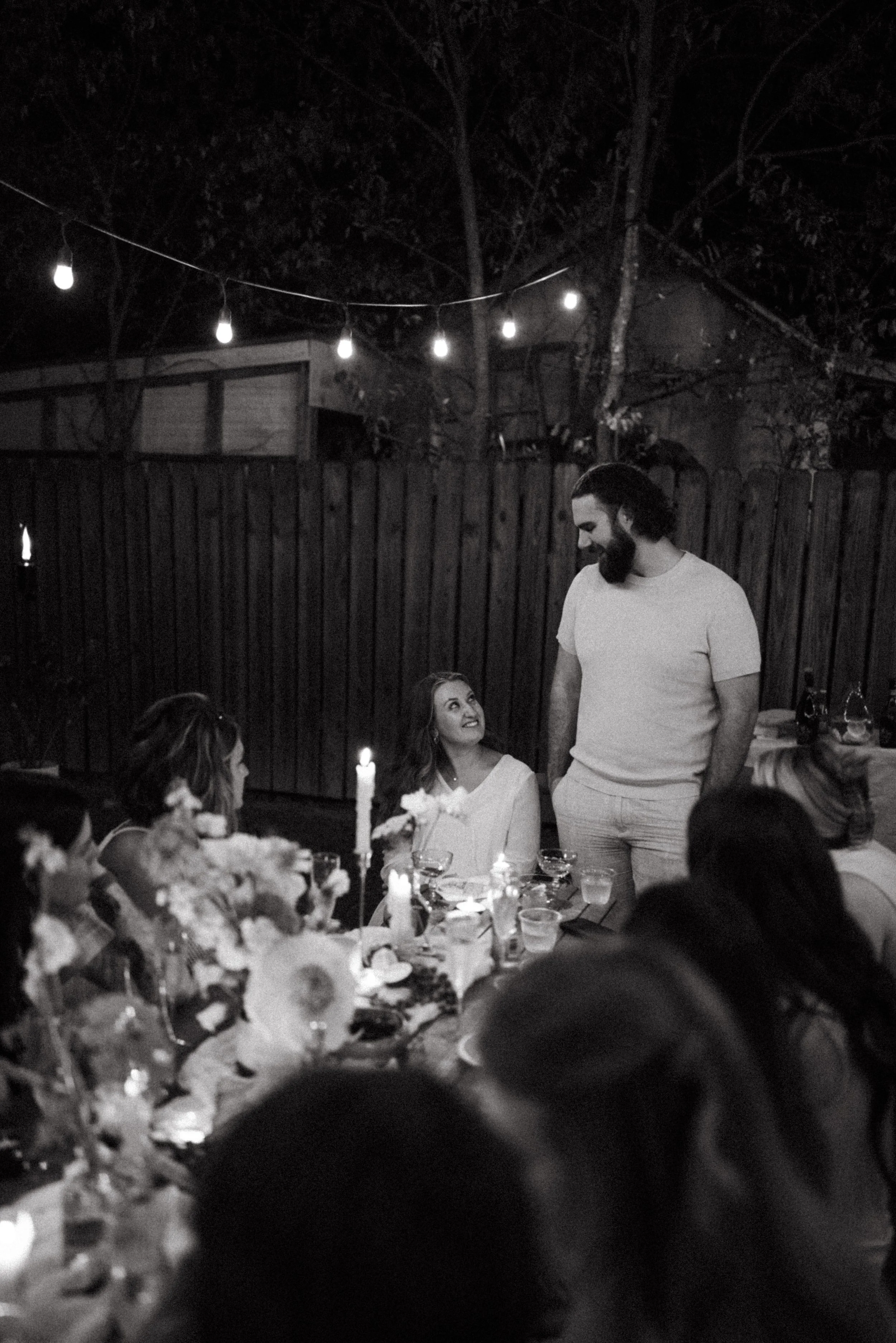 Austin wedding photographer capturing heartfelt speeches at engagement party