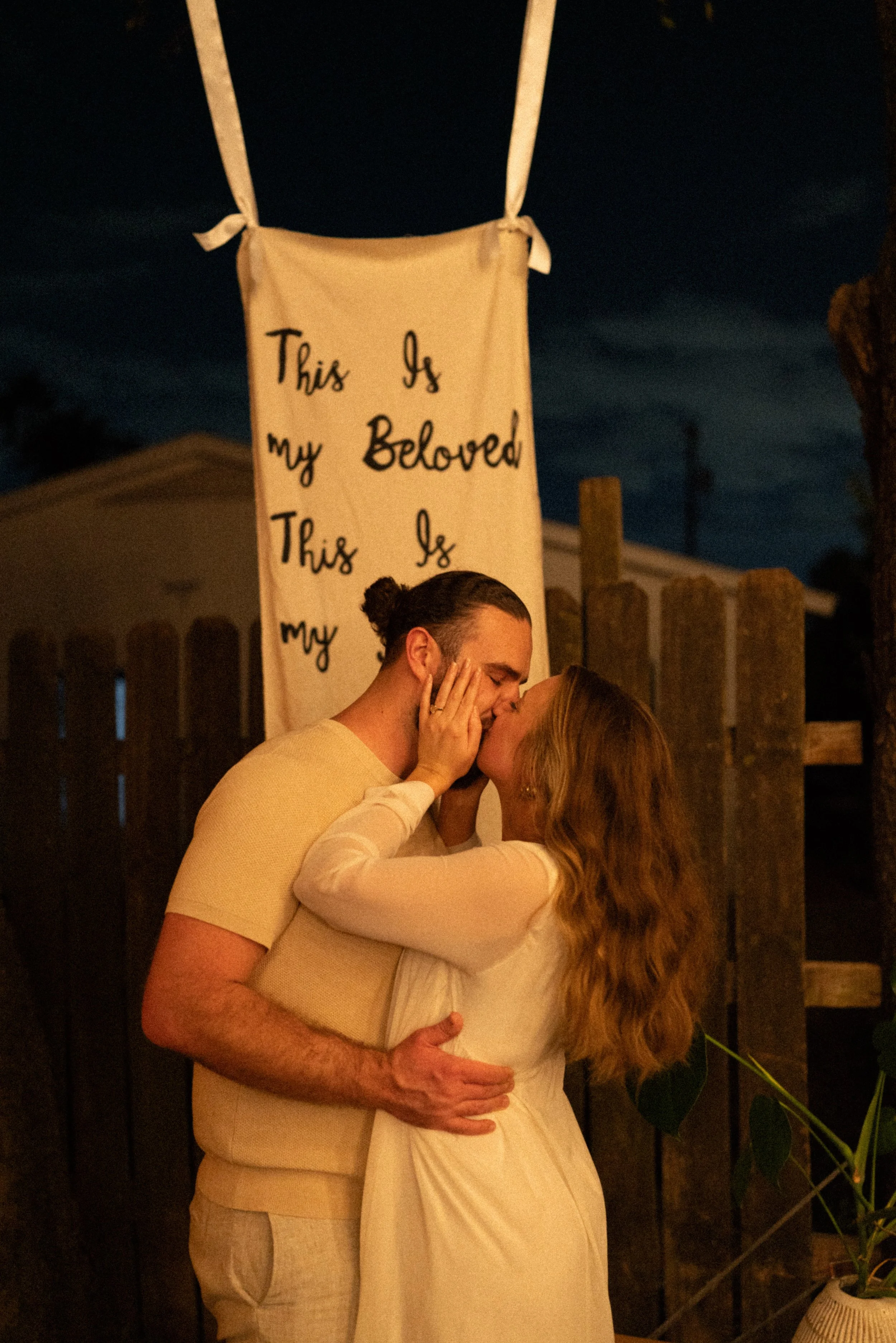Documentary style wedding photography of couple celebrating engagement with loved ones