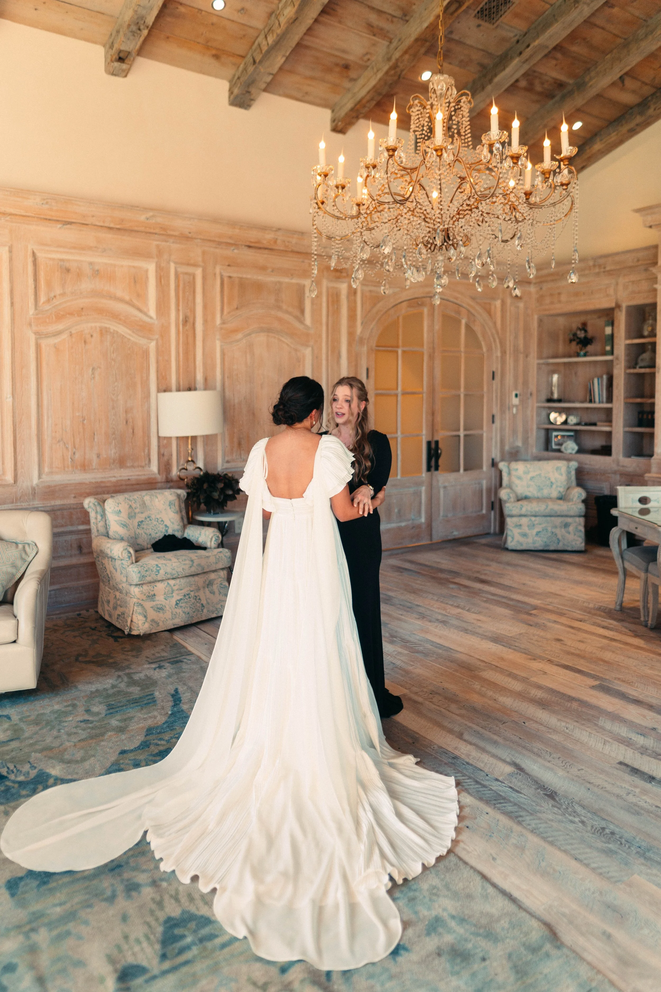Bride sharing an emotional first look with her bridesmaids at Houston Oaks | documentary Austin travel wedding photographer.