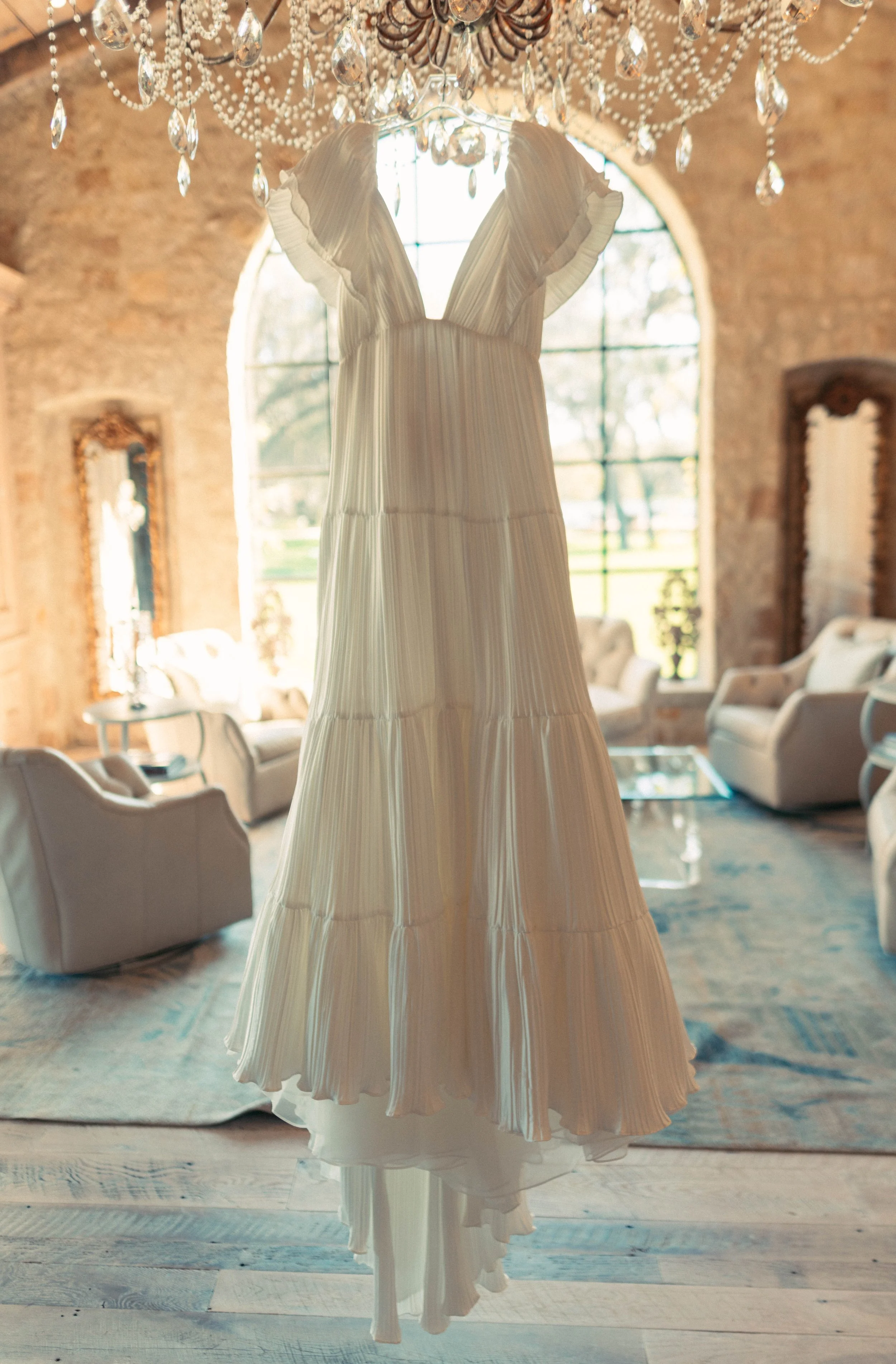 Bride’s pleated gown photographed before Houston Oaks ceremony.