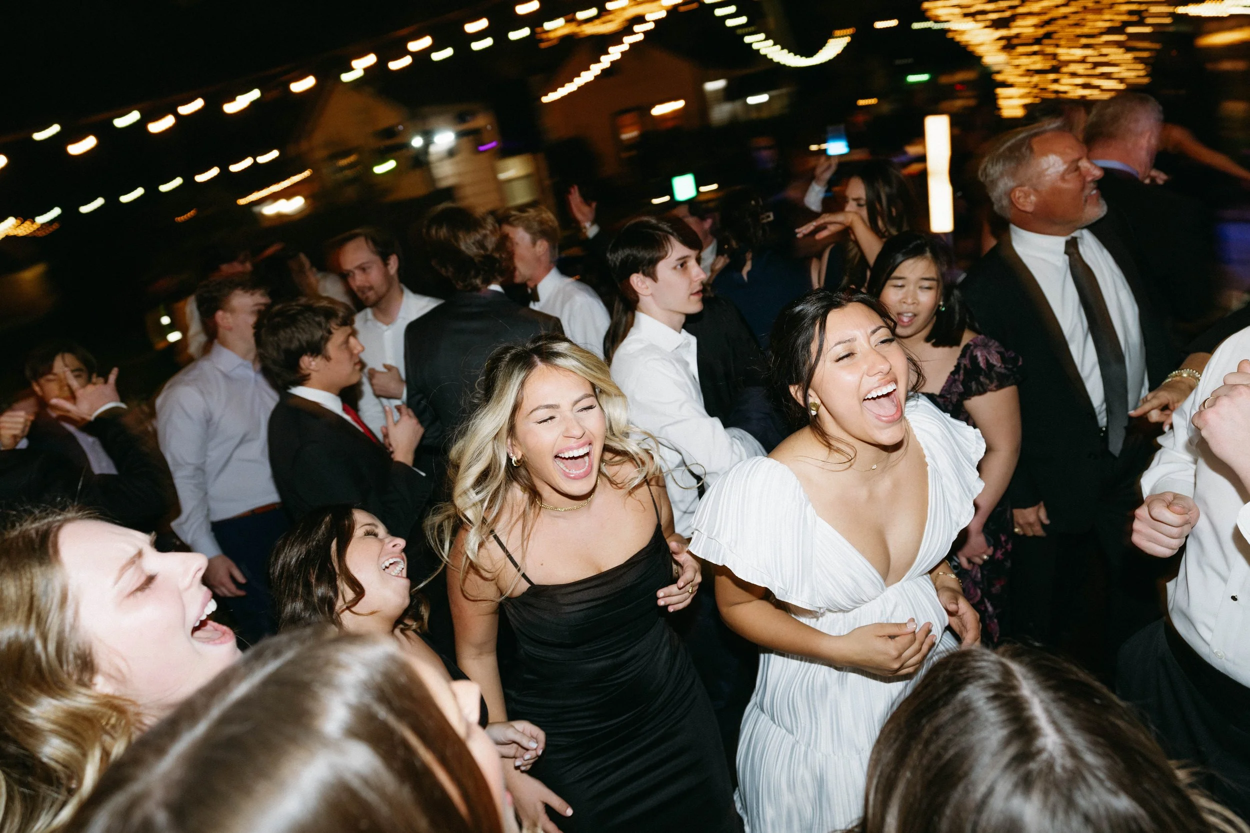 Bride singing along with Hybrid 7 band during reception performance.