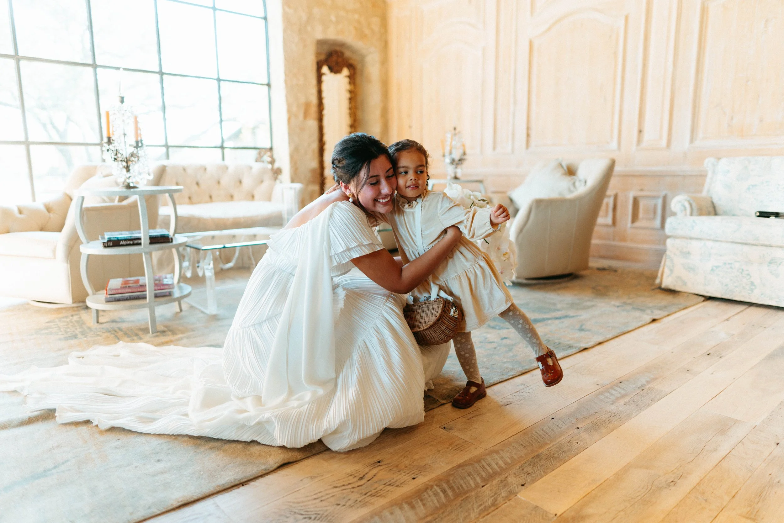 Bride sharing an emotional first look with her bridesmaids at Houston Oaks | documentary Austin travel wedding photographer.