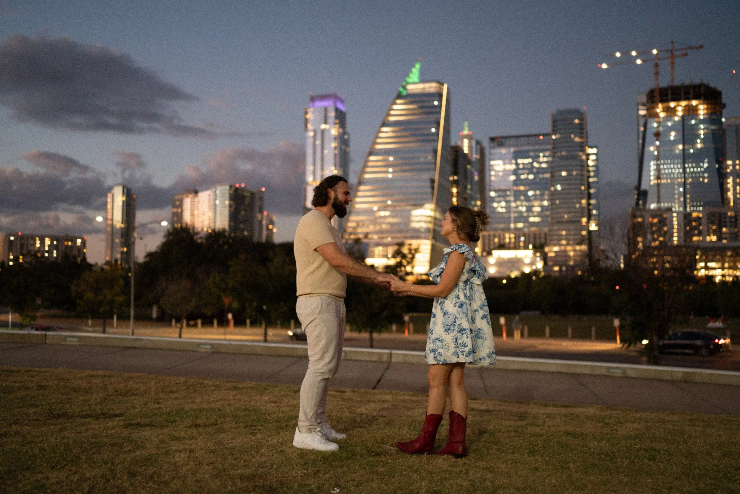 Bride-to-be surprised during proposal at Auditorium Shores with Austin skyline