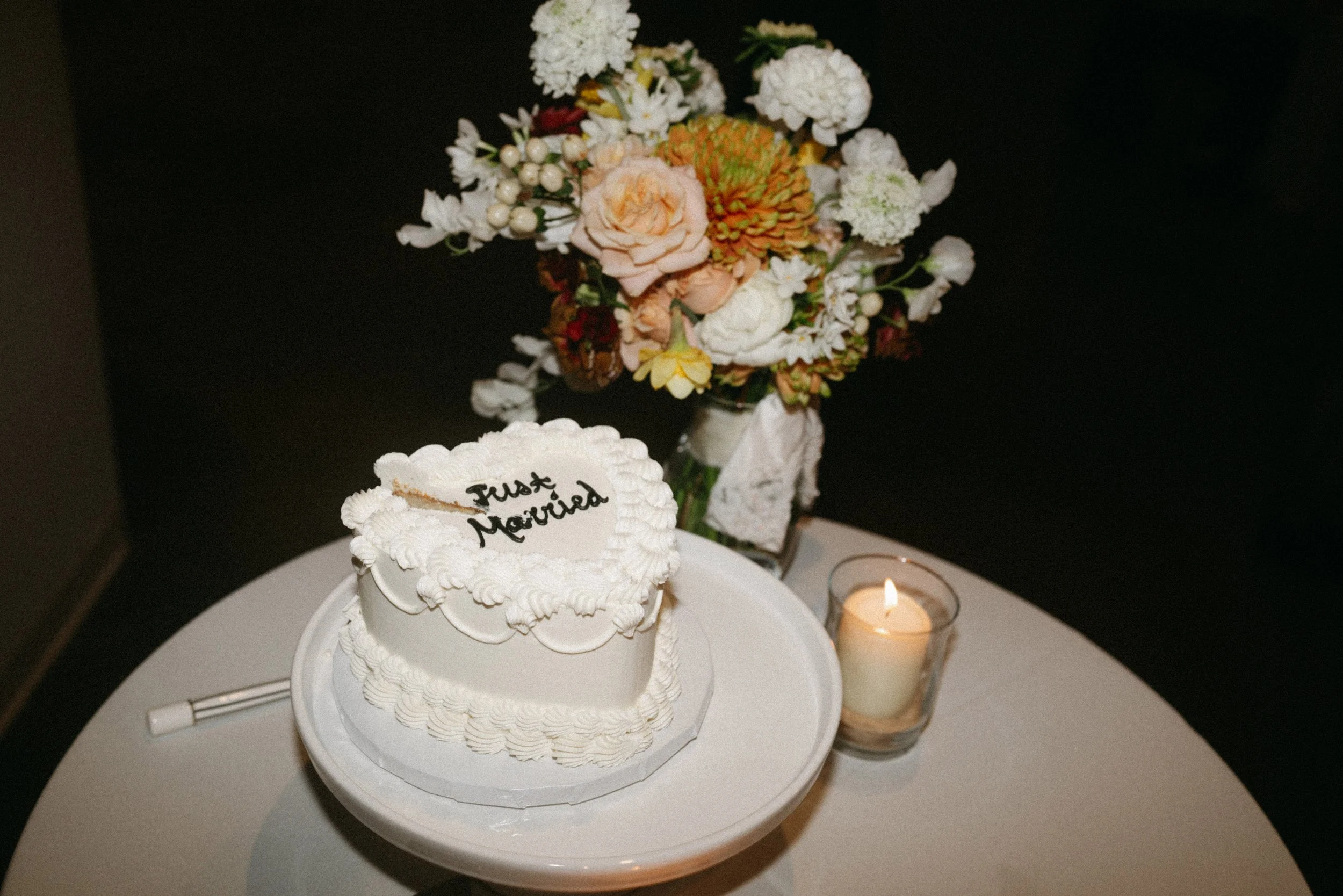 Wedding cake and custom florals at The Grand Lady wedding reception in Austin