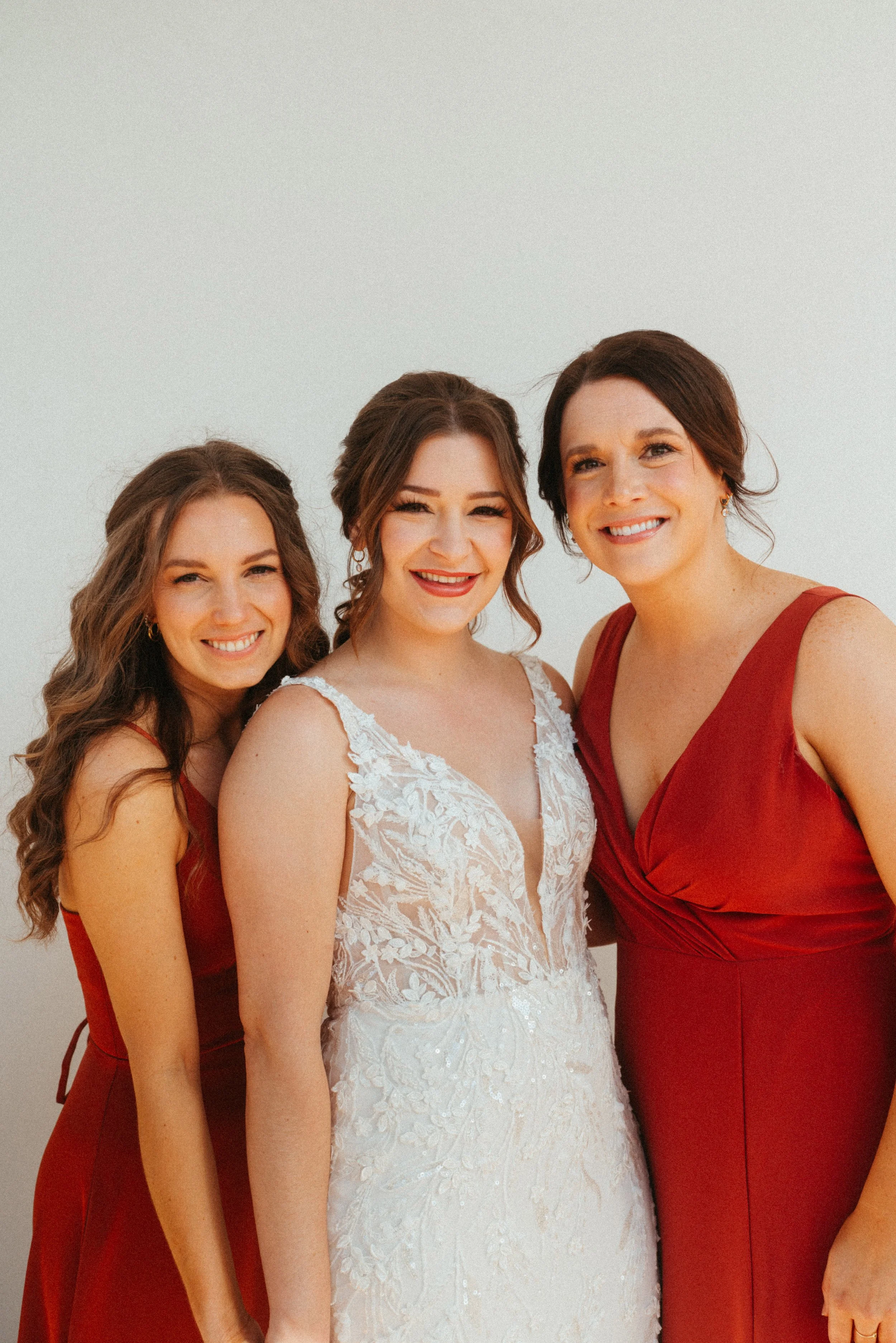 Bridesmaids in beautiful red bridesmaids dresses at The Grand Lady Austin wedding