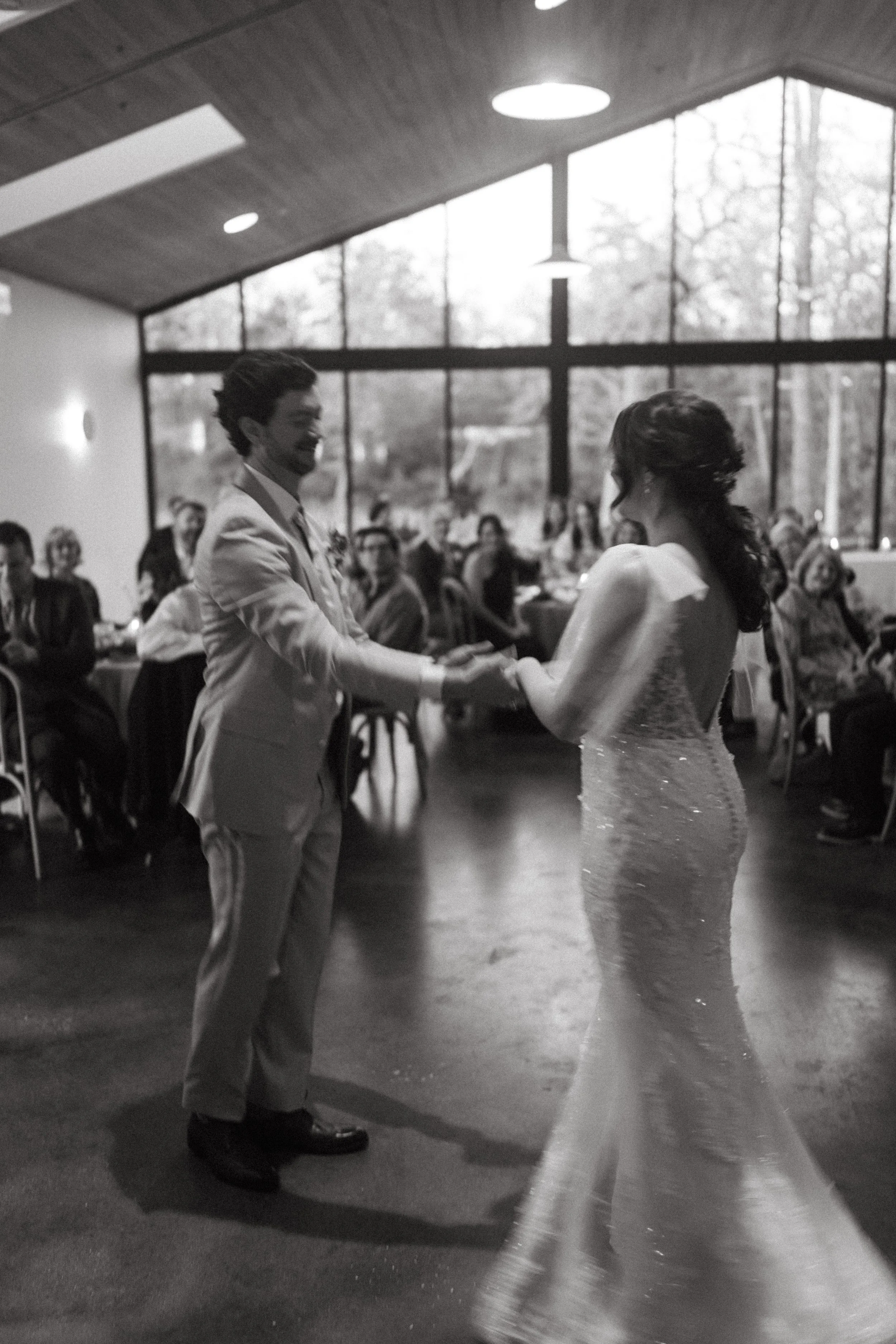 First dance of bride and groom inside The Grand Lady modern reception hall