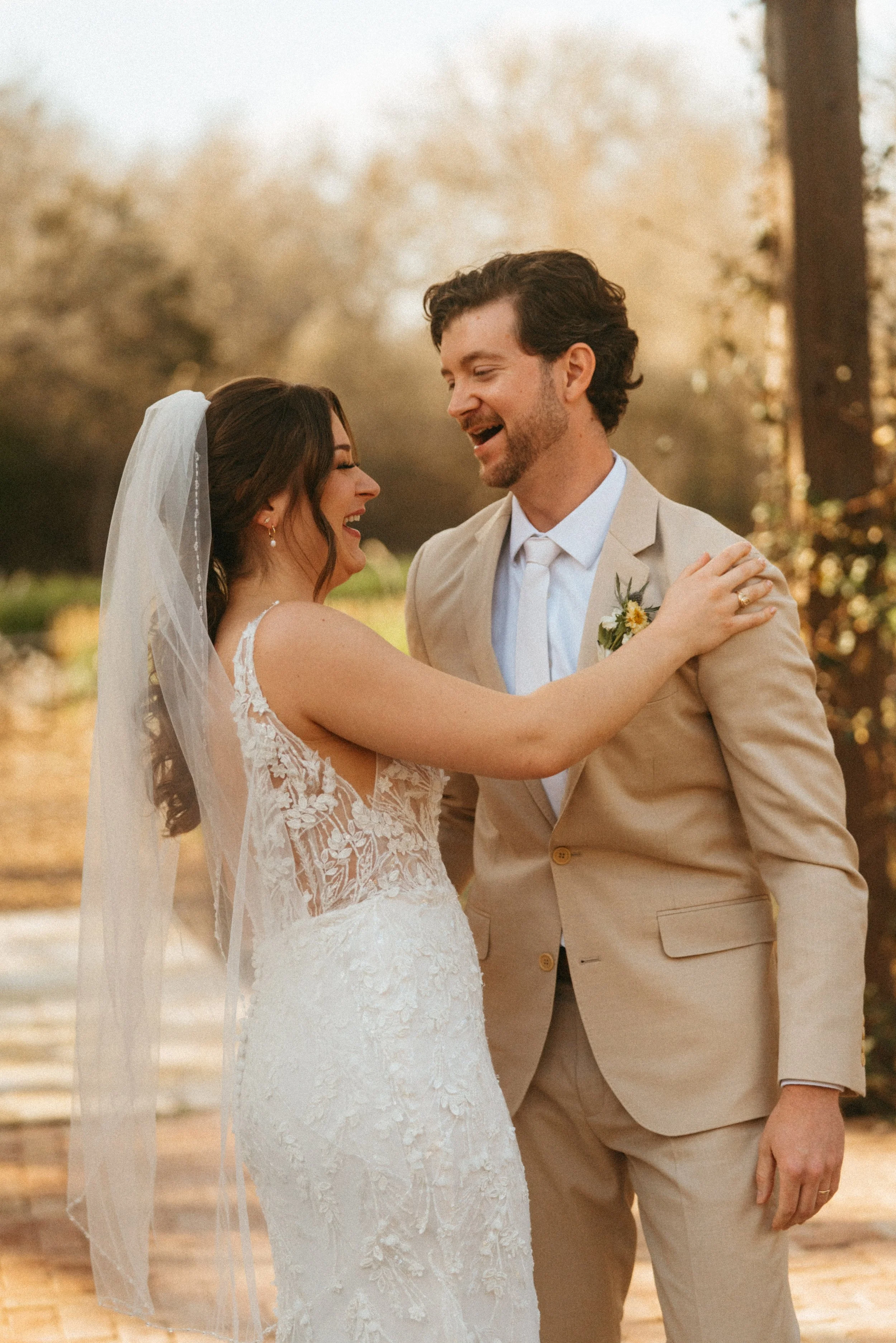 Bride and groom share first kiss under pergola at The Grand Lady wedding ceremony