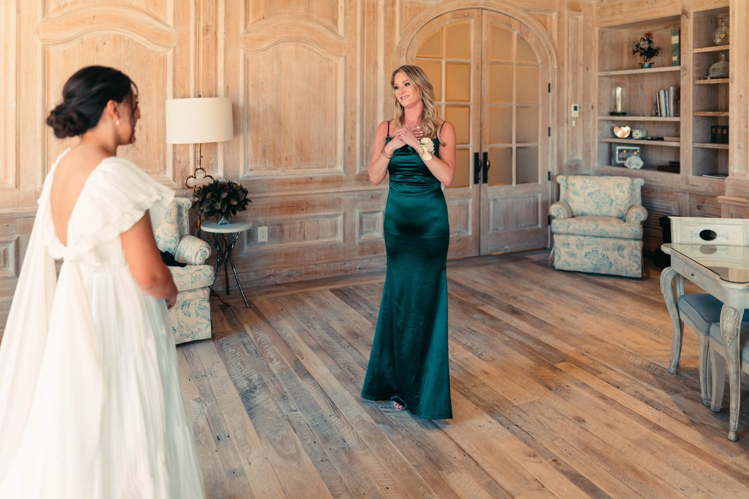 Bride sharing an emotional first look with her bridesmaids at Houston Oaks | documentary Austin travel wedding photographer.