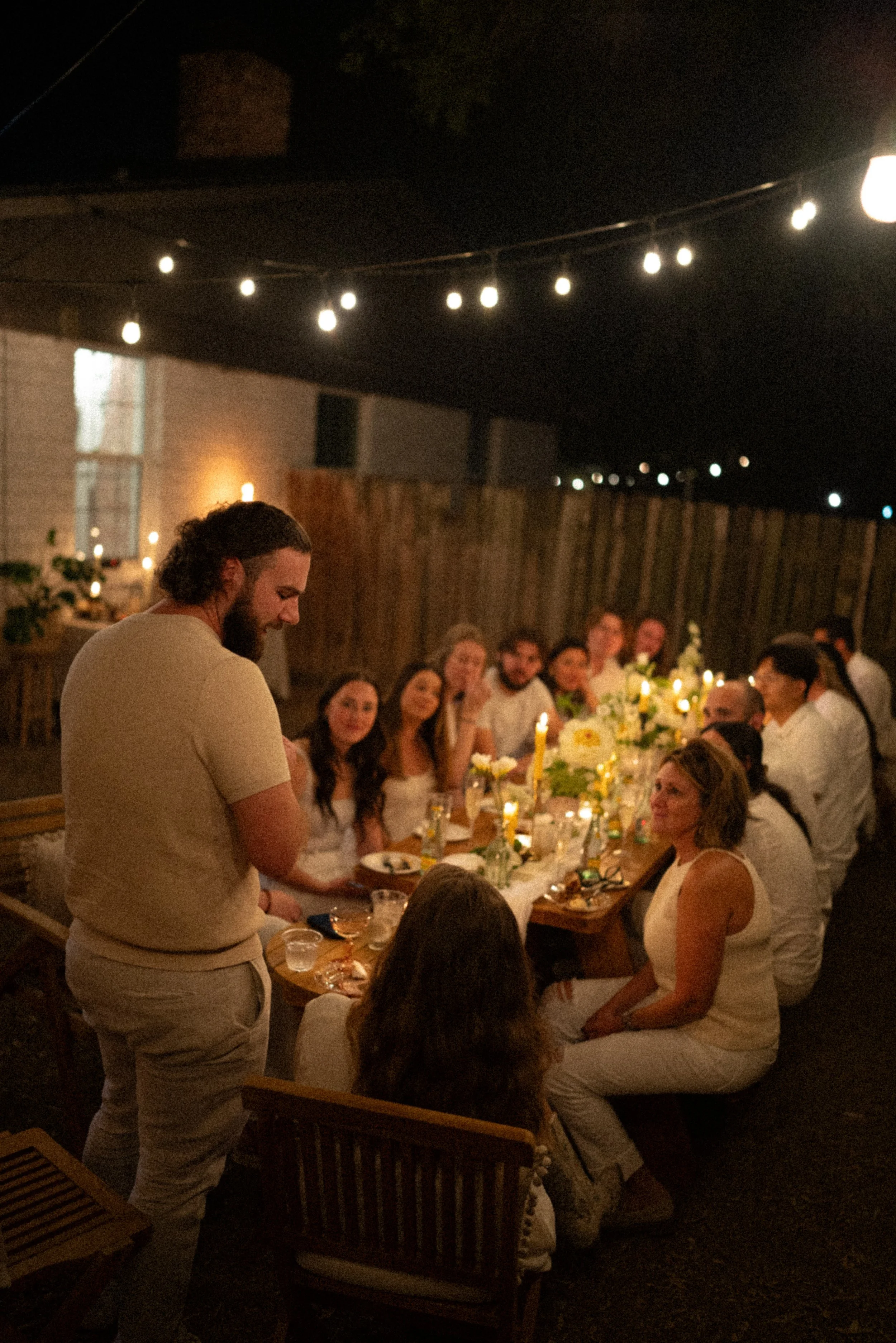 Austin wedding photographer capturing heartfelt speeches at engagement party