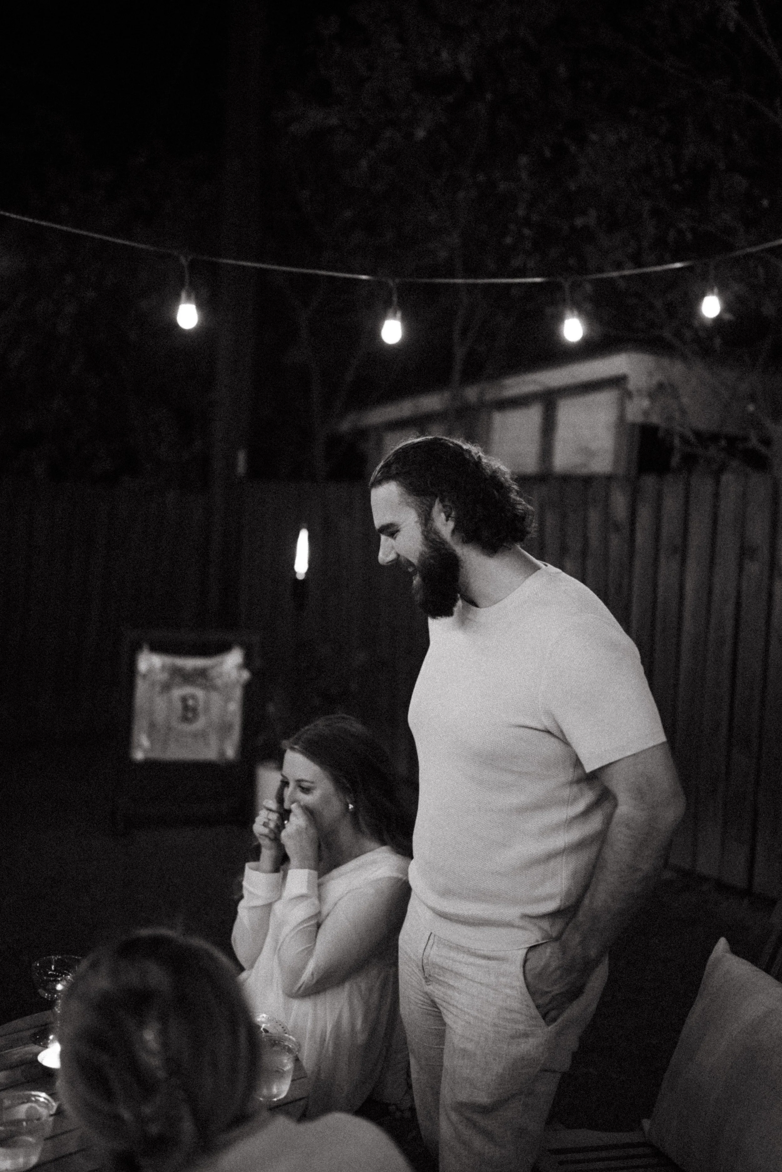 Austin wedding photographer capturing heartfelt speeches at engagement party