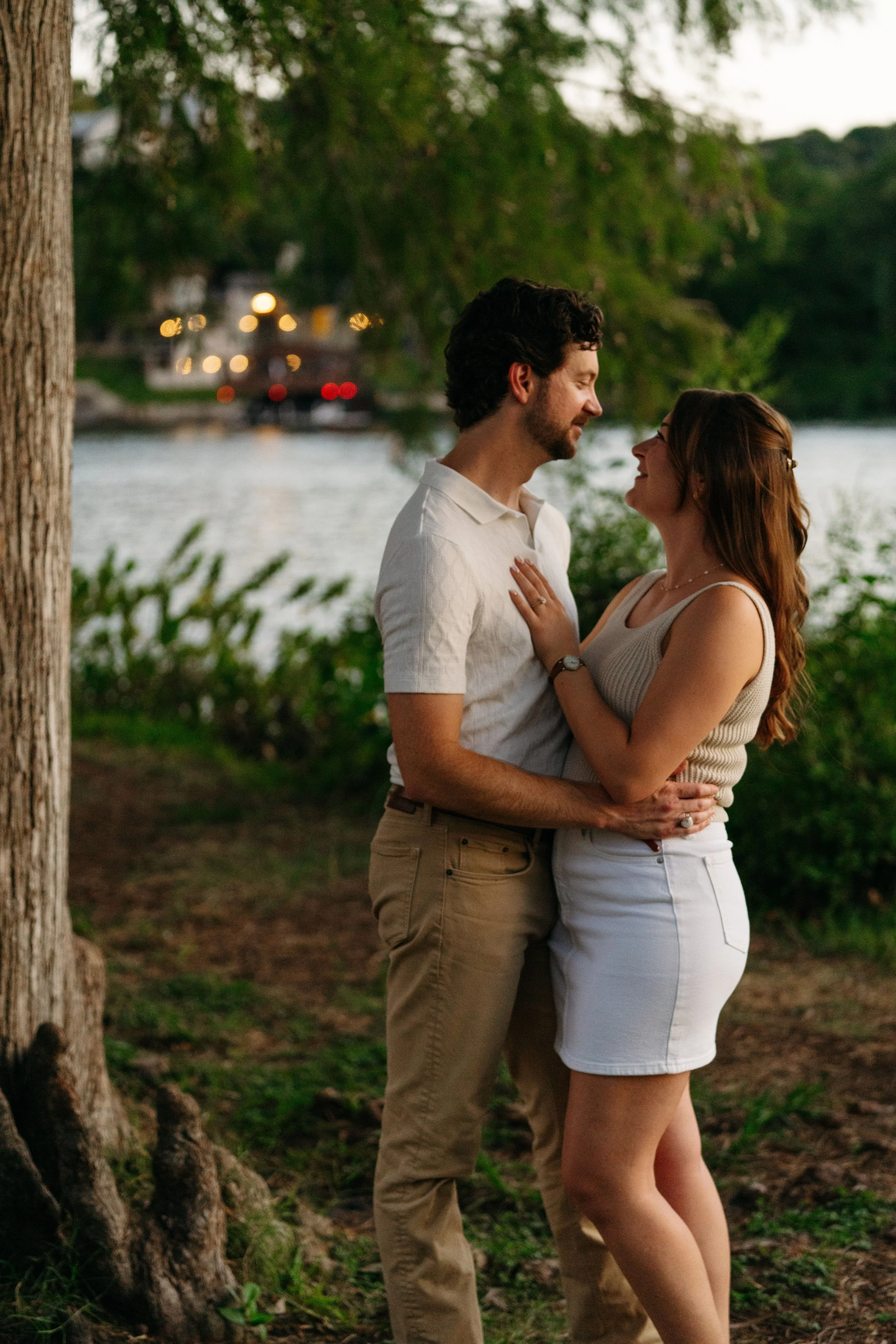 Couple holding hands at sunset during Austin proposal photography session