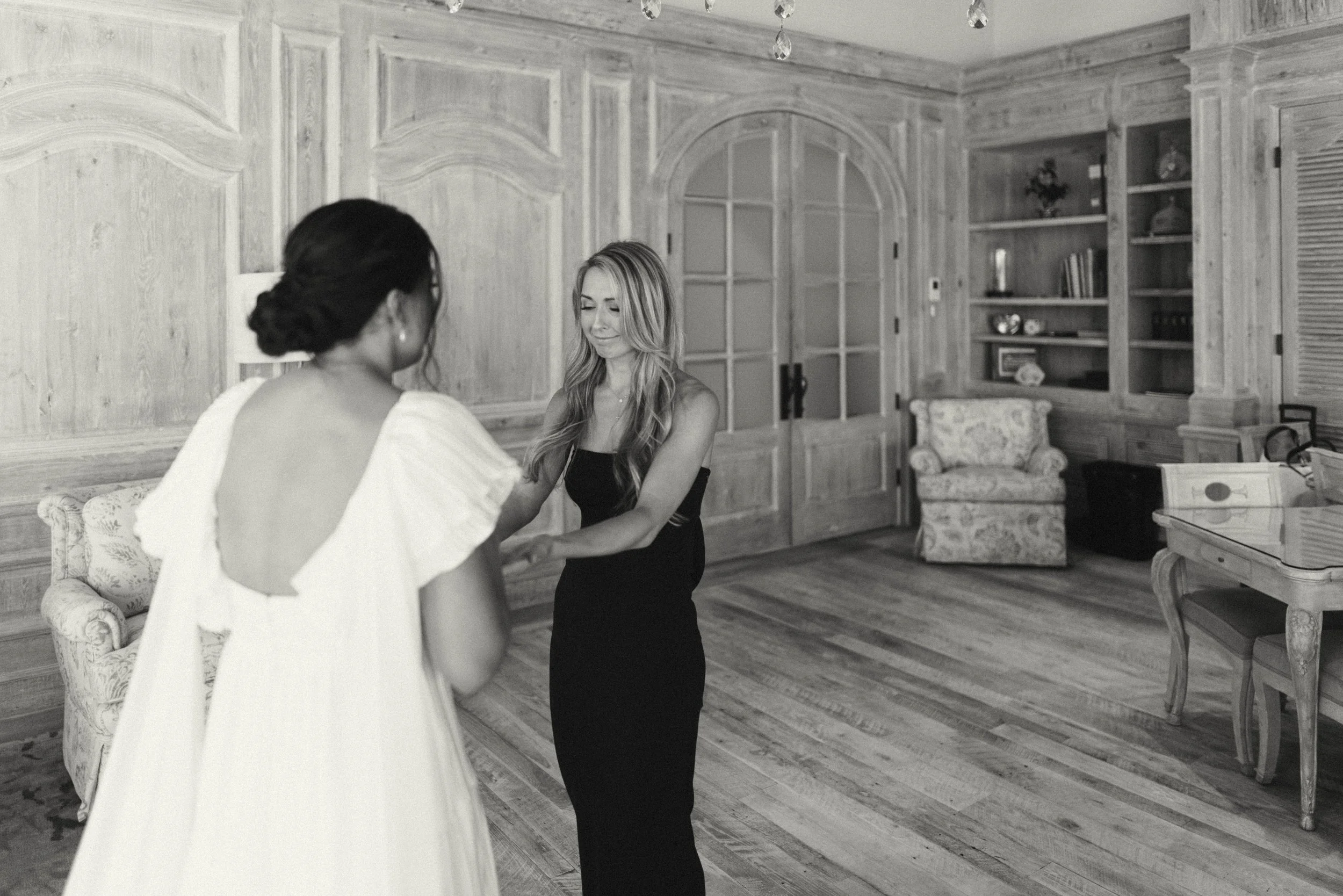 Bride sharing an emotional first look with her bridesmaids at Houston Oaks | documentary Austin travel wedding photographer.